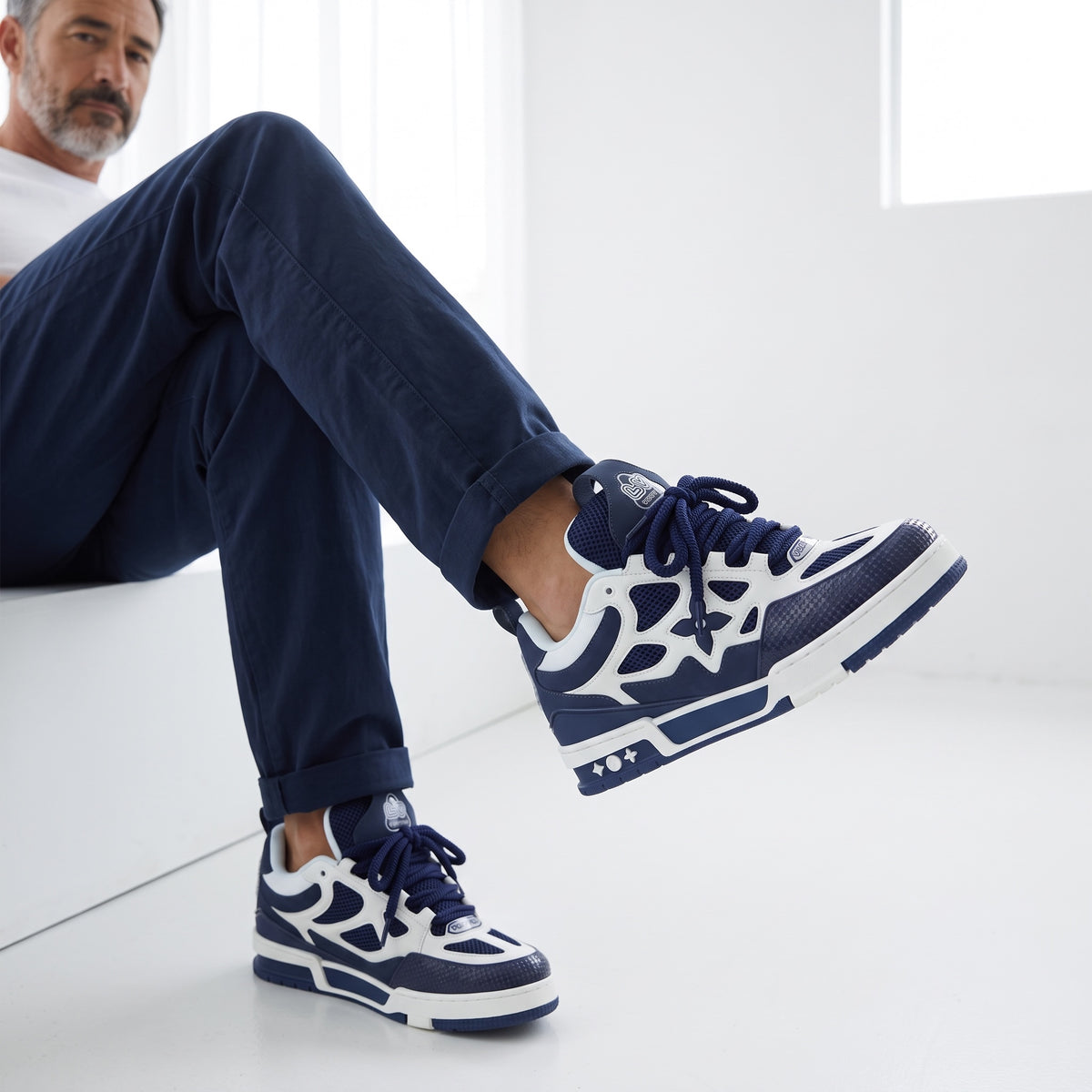 Louis Vuitton navy and white chunky trainer with monogram floral motif