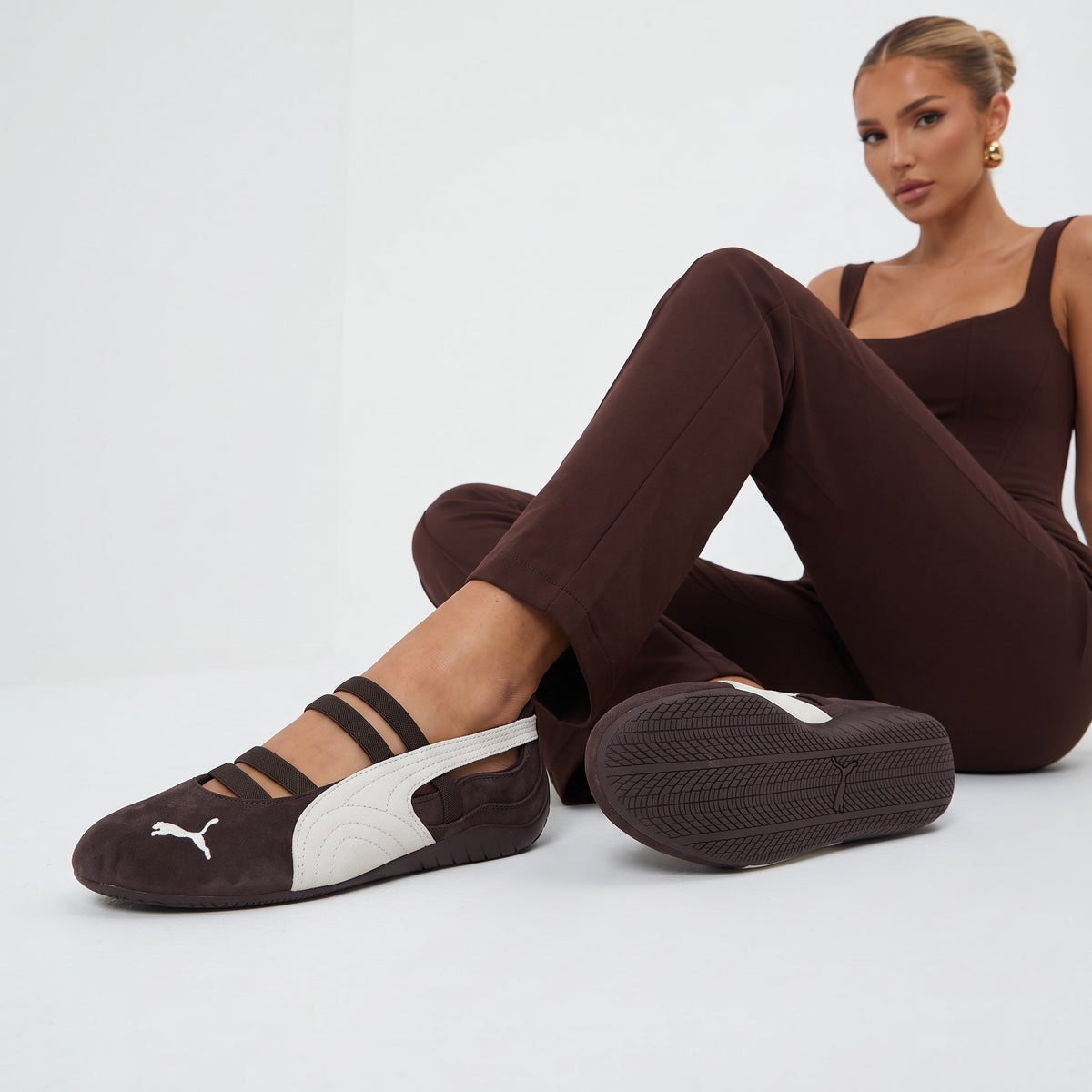 Brown Puma Mary-Jane ballet-style trainer with white formstrip and elastic straps
