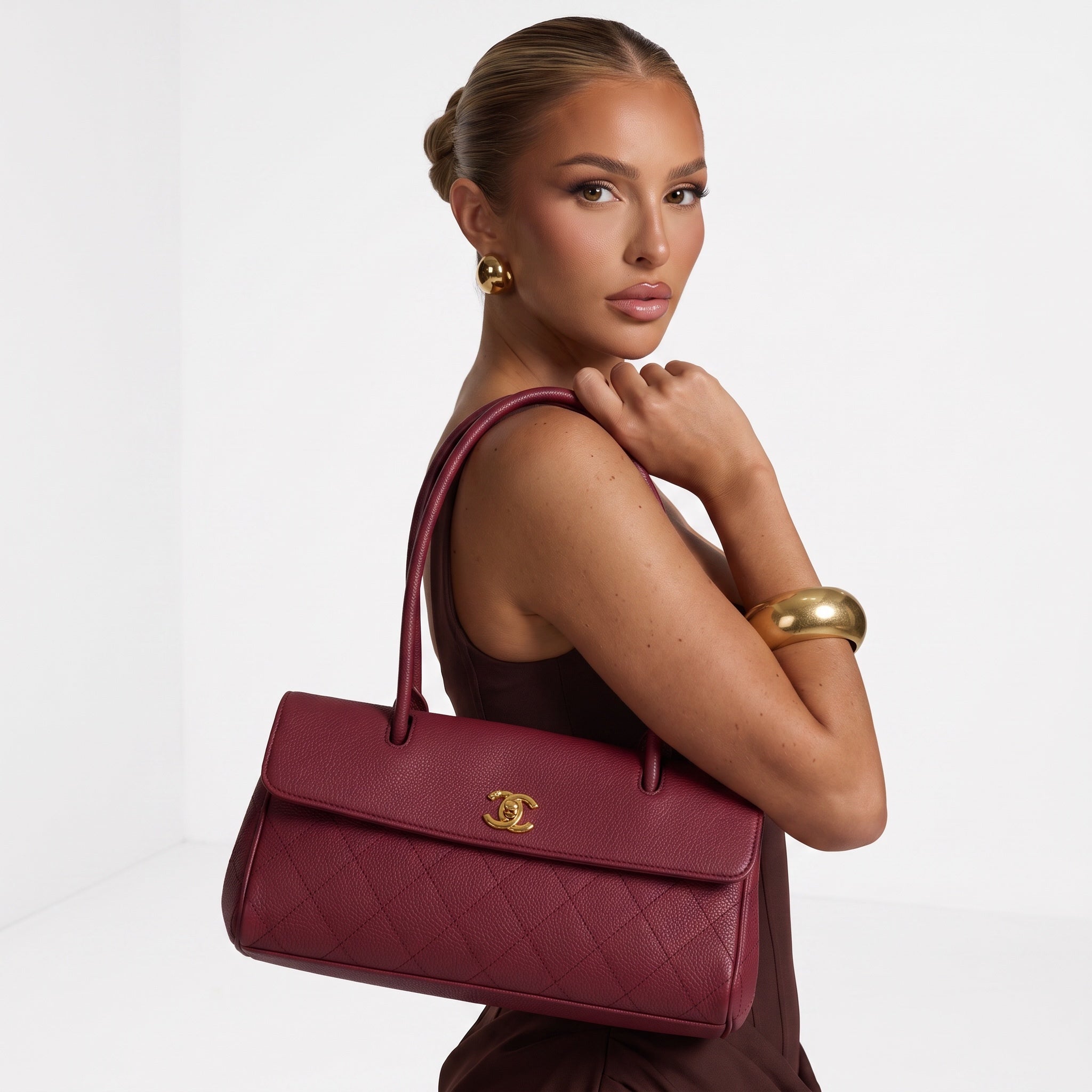 Burgundy Chanel quilted tote bag with gold CC turn-lock and double rounded top handles