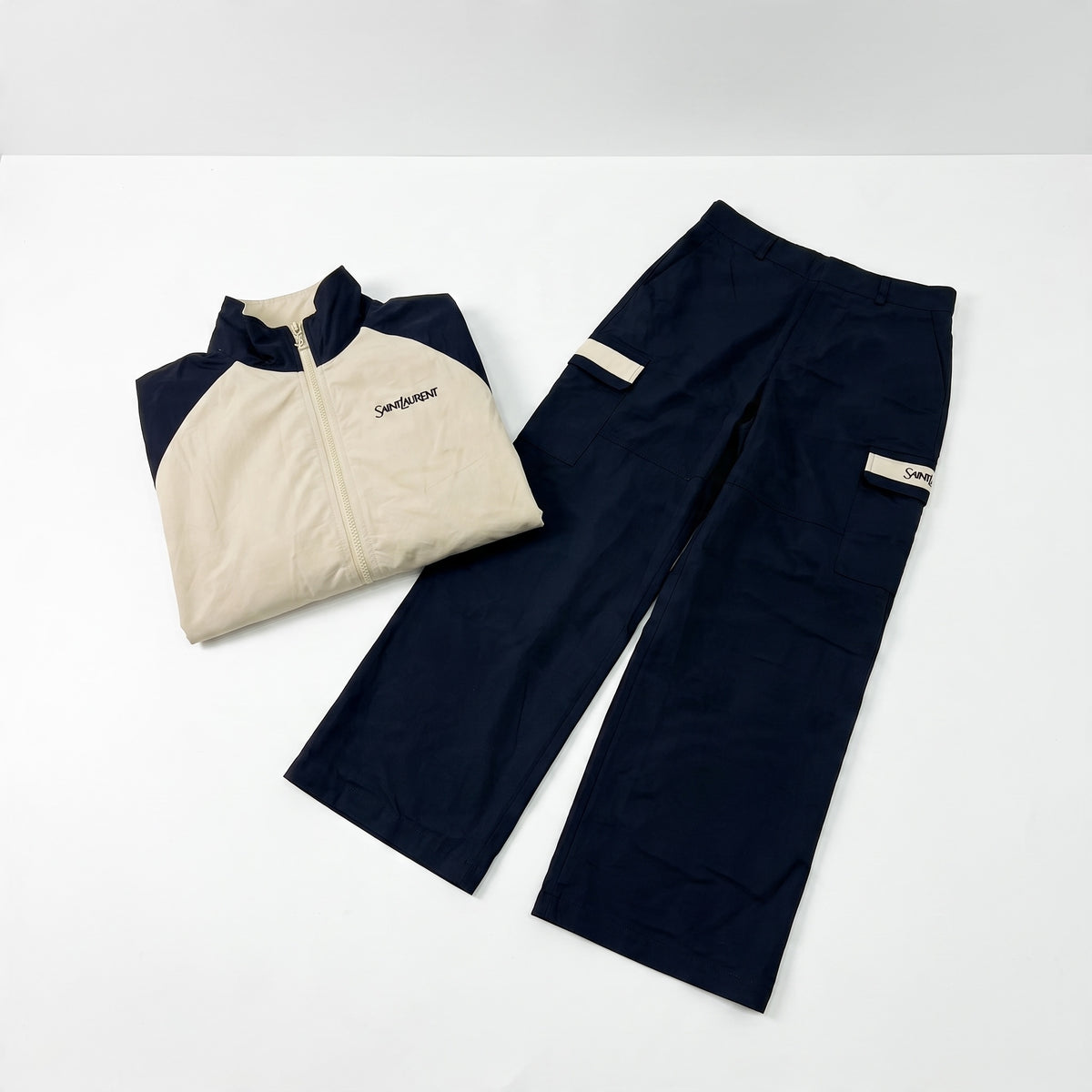 Saint Laurent beige and navy track jacket with cargo trousers laid flat and on model