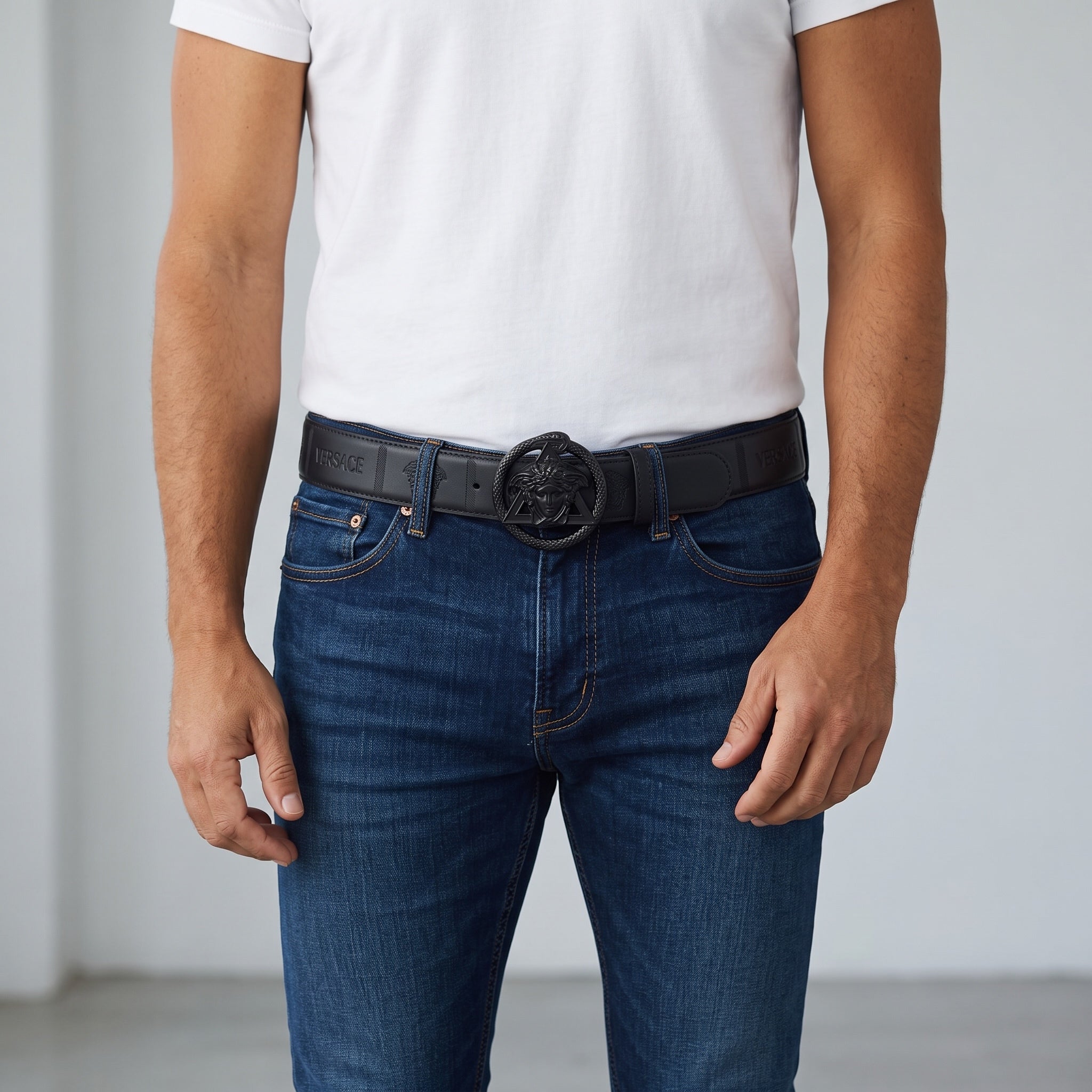 Black Versace belt with Medusa buckle worn with jeans
