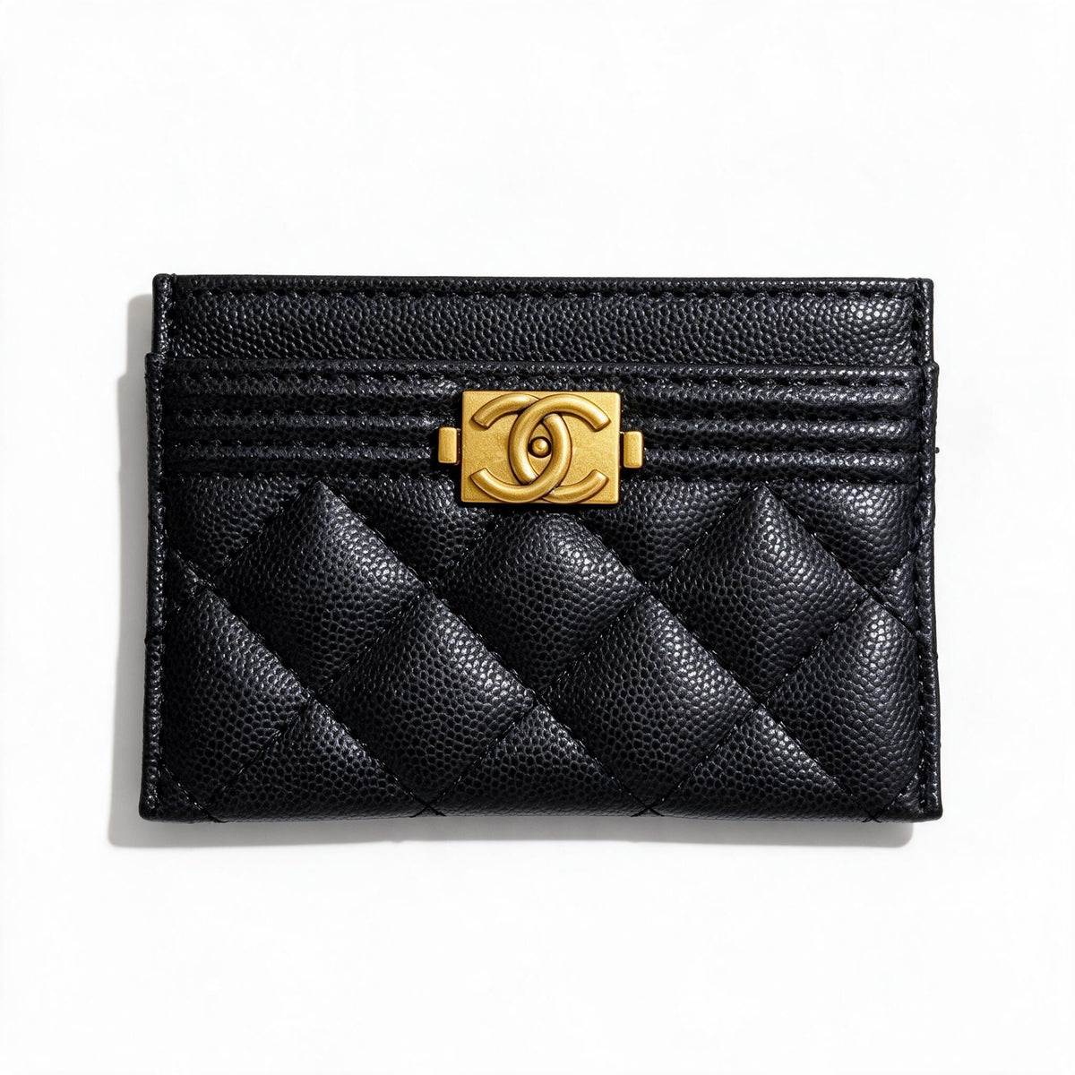 Black quilted Chanel card holder with gold CC clasp, top card slots visible