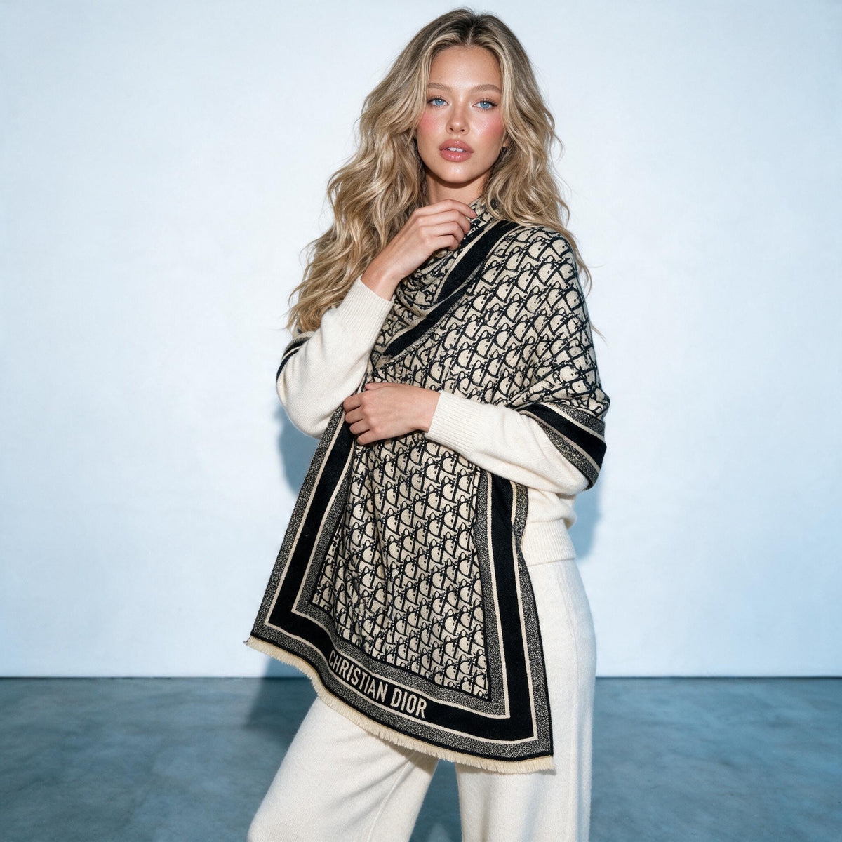 Beige and black Dior monogram shawl draped on a model