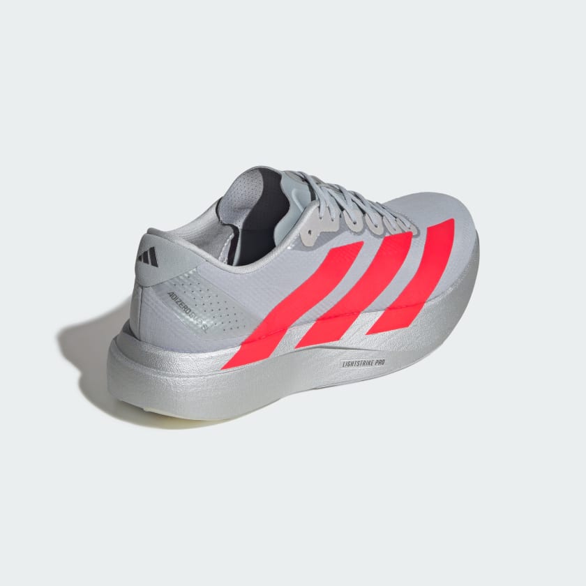 silver adidas adizero running shoe with solar red three stripes