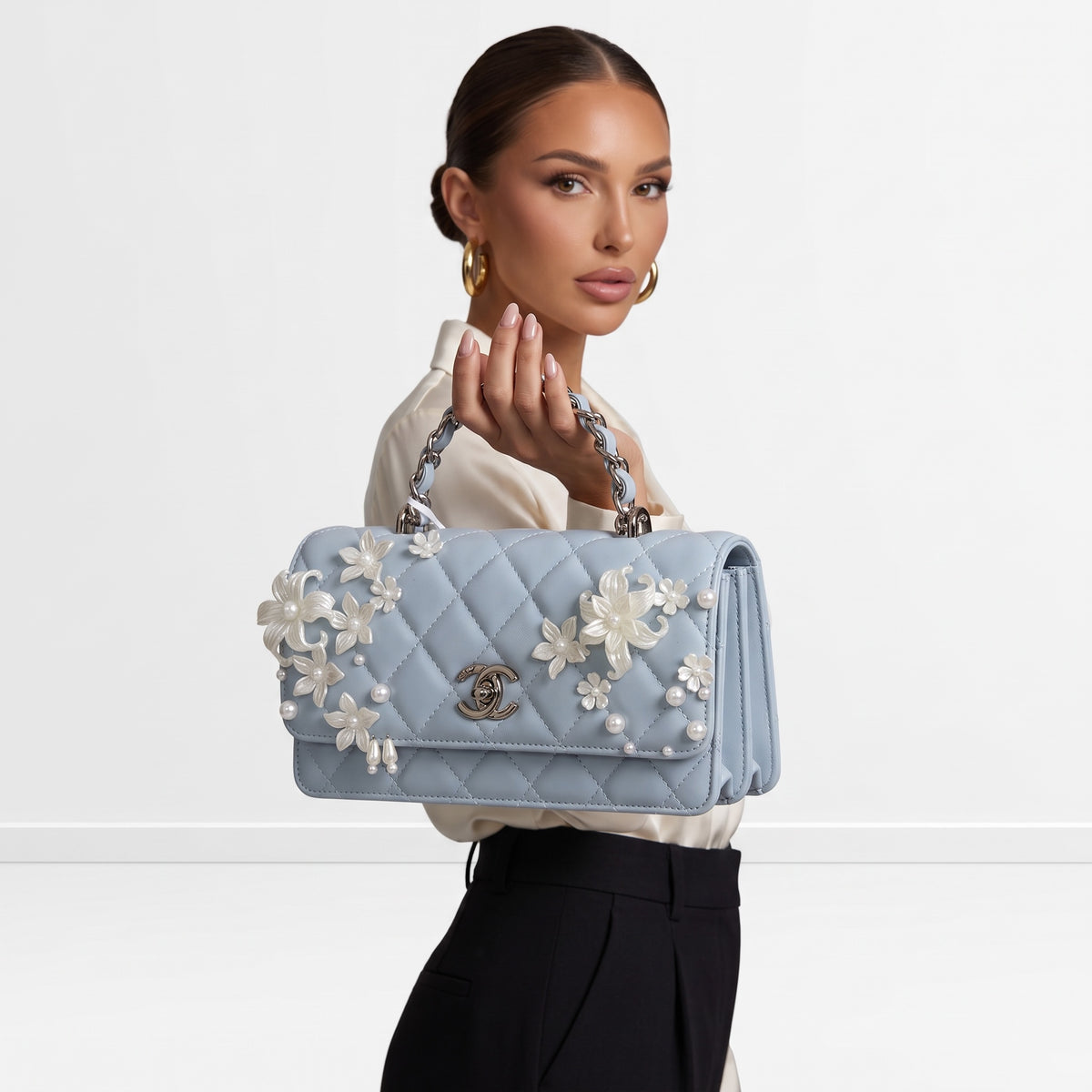 Chanel baby blue quilted mini flap bag with pearlescent floral appliqués and chain top handle