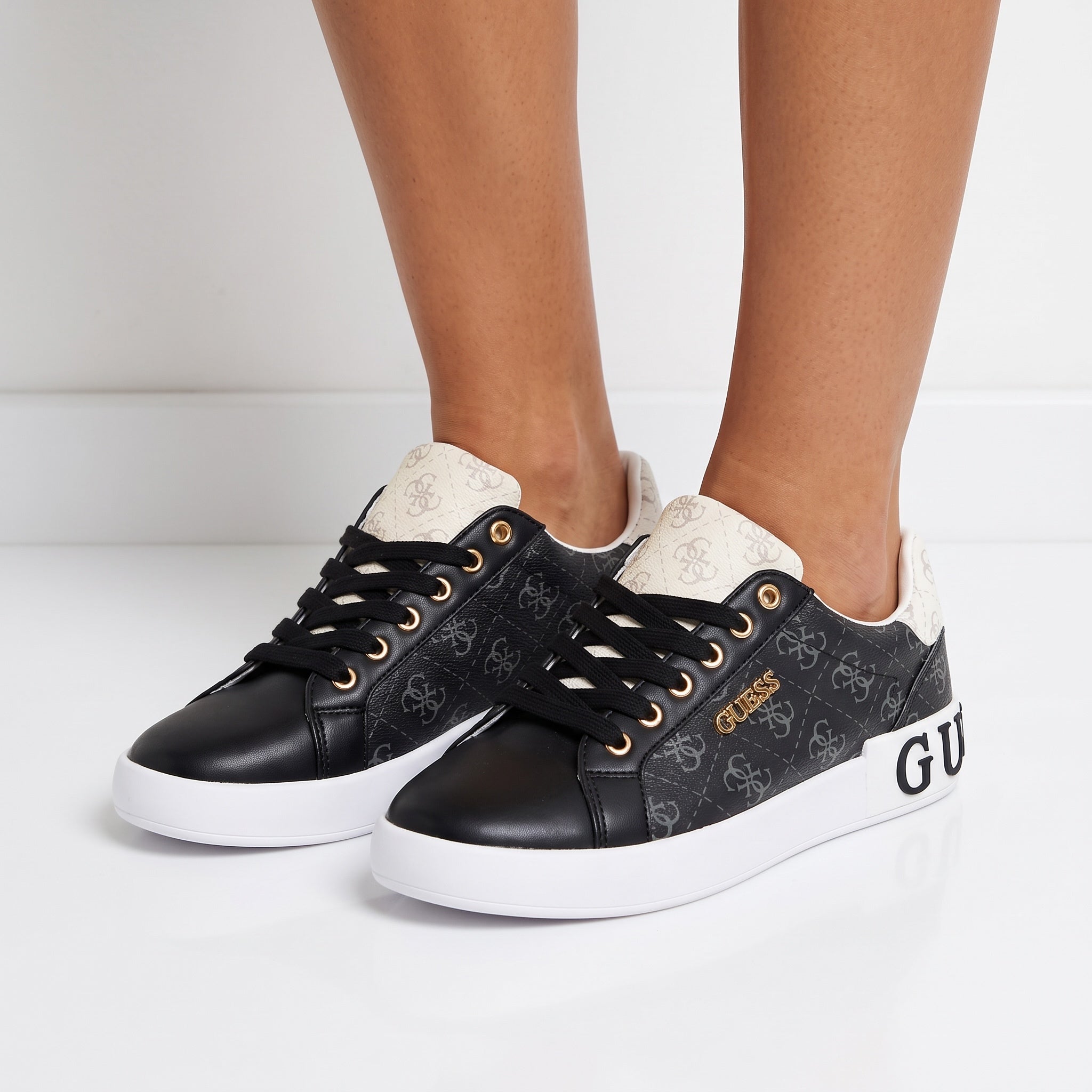 black Guess low-top sneakers with white platform and logo print