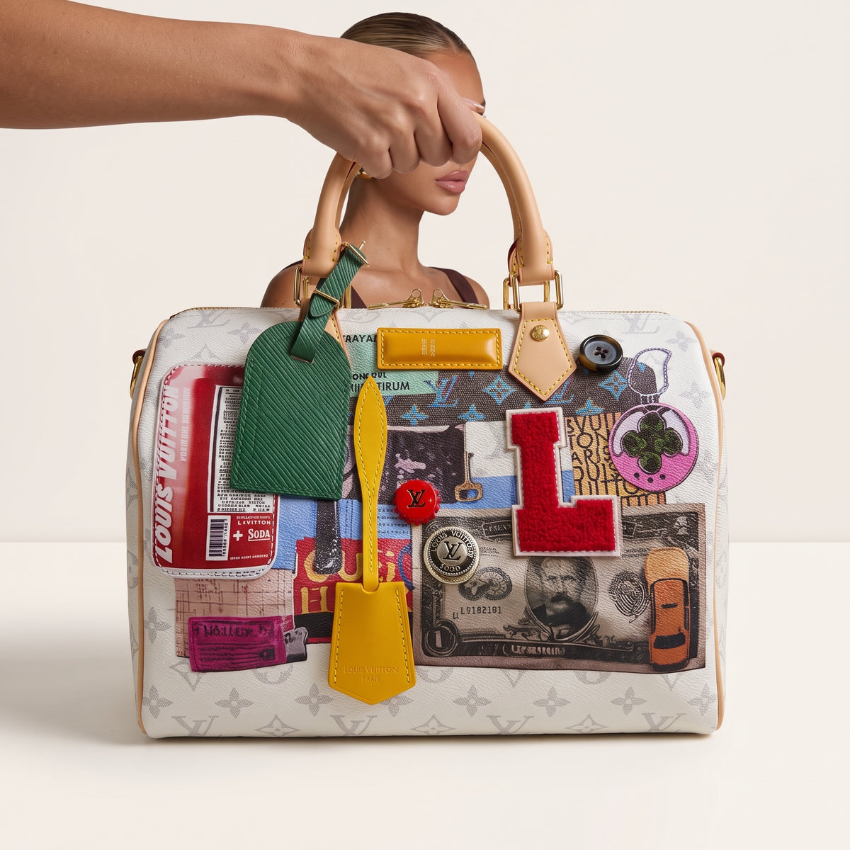 Louis Vuitton multicolor patchwork top-handle bag with gold hardware and monogram print