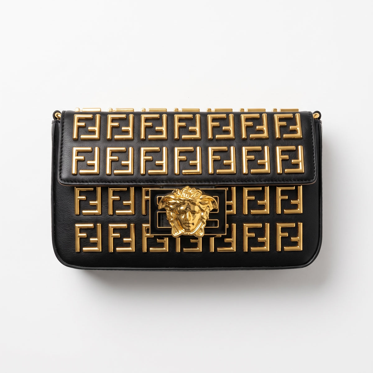 Black shoulder bag with repeating FF logo studs and gold Medusa plaque