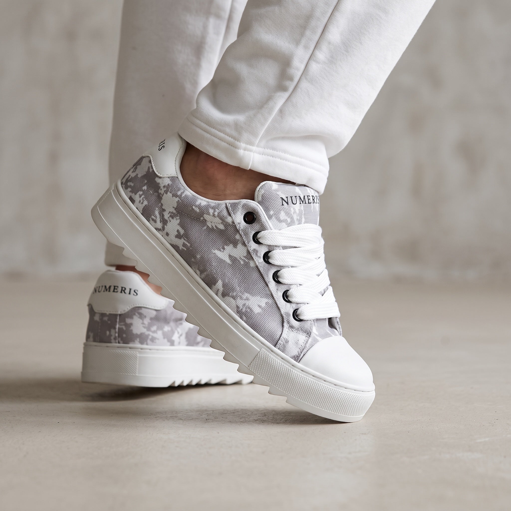 Grey camo Numeris low-top platform sneakers with white sole