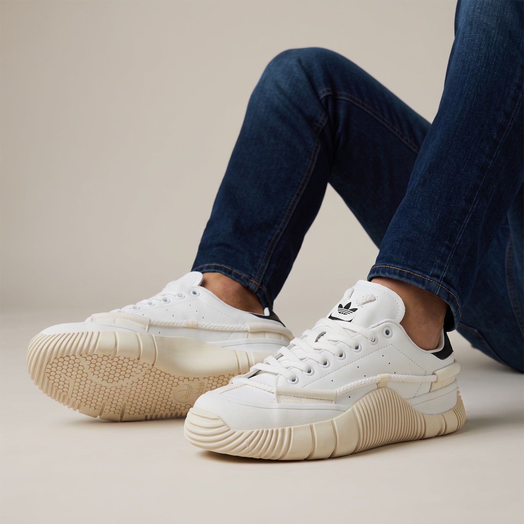White Adidas Stan Smith low-top sneakers with cream chunky sole and black heel tab