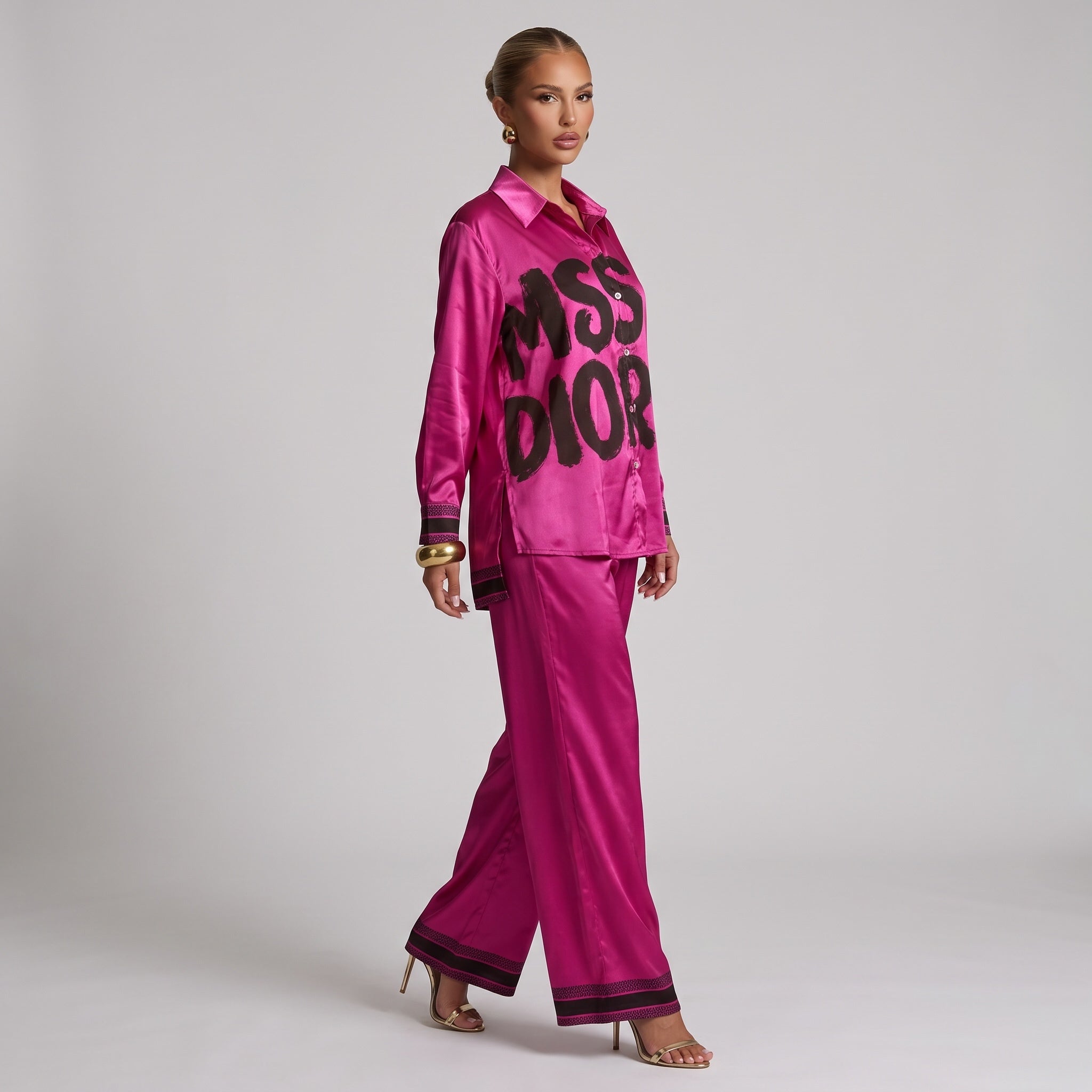 Fuchsia longline button-down shirt with black graphic lettering