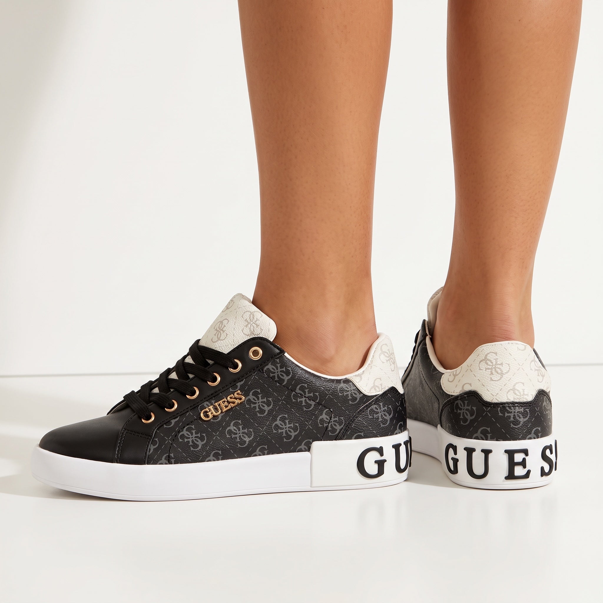 black Guess low-top sneakers with white platform and logo print