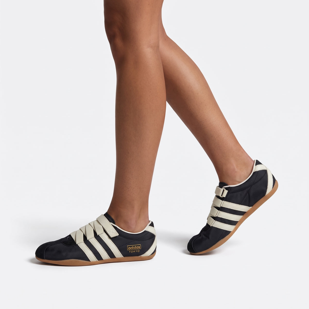 adidas Tokio black trainers with cream stripes and gum sole