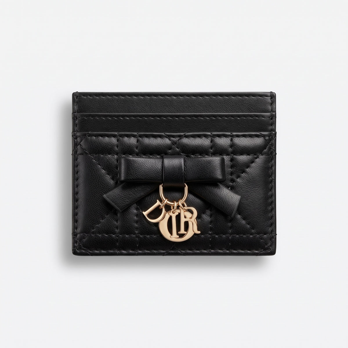 black quilted Dior card holder with bow and gold letter charms