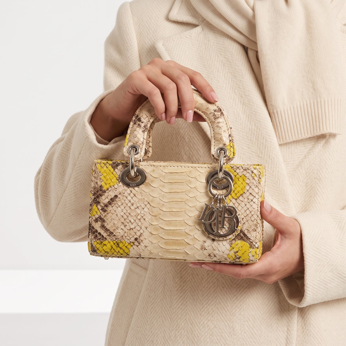 Cream and yellow python mini Lady Dior top-handle bag with silver charms
