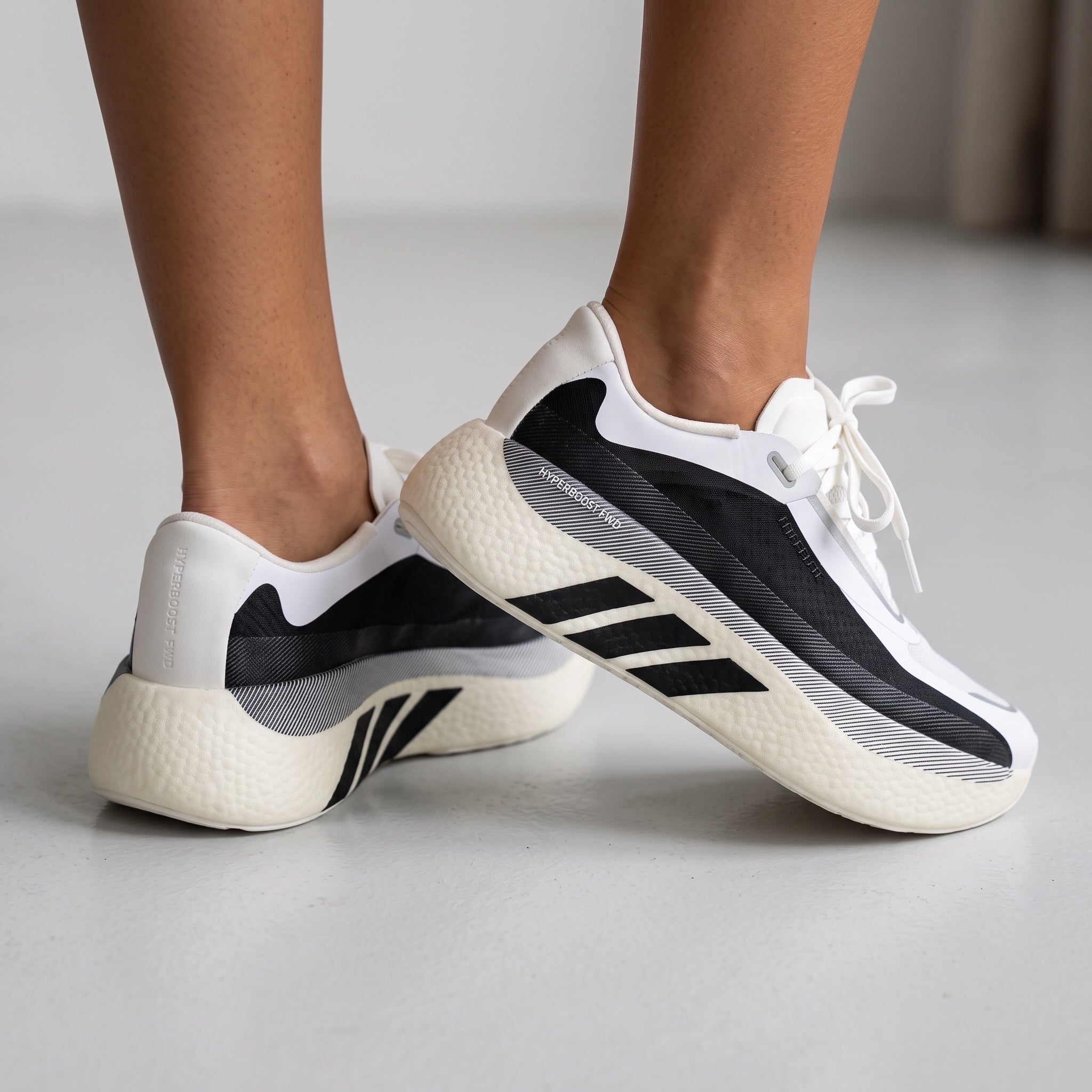 Adidas Superboost 700 white and black sneakers with thick cushioned midsole