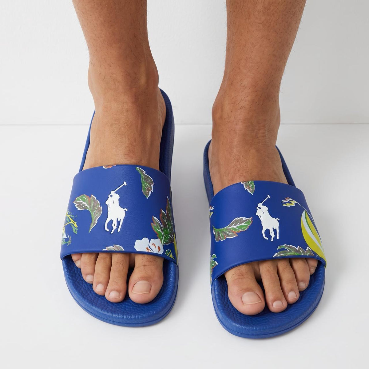 Blue Polo Ralph Lauren men's slide sandals with tropical floral print and white pony logo