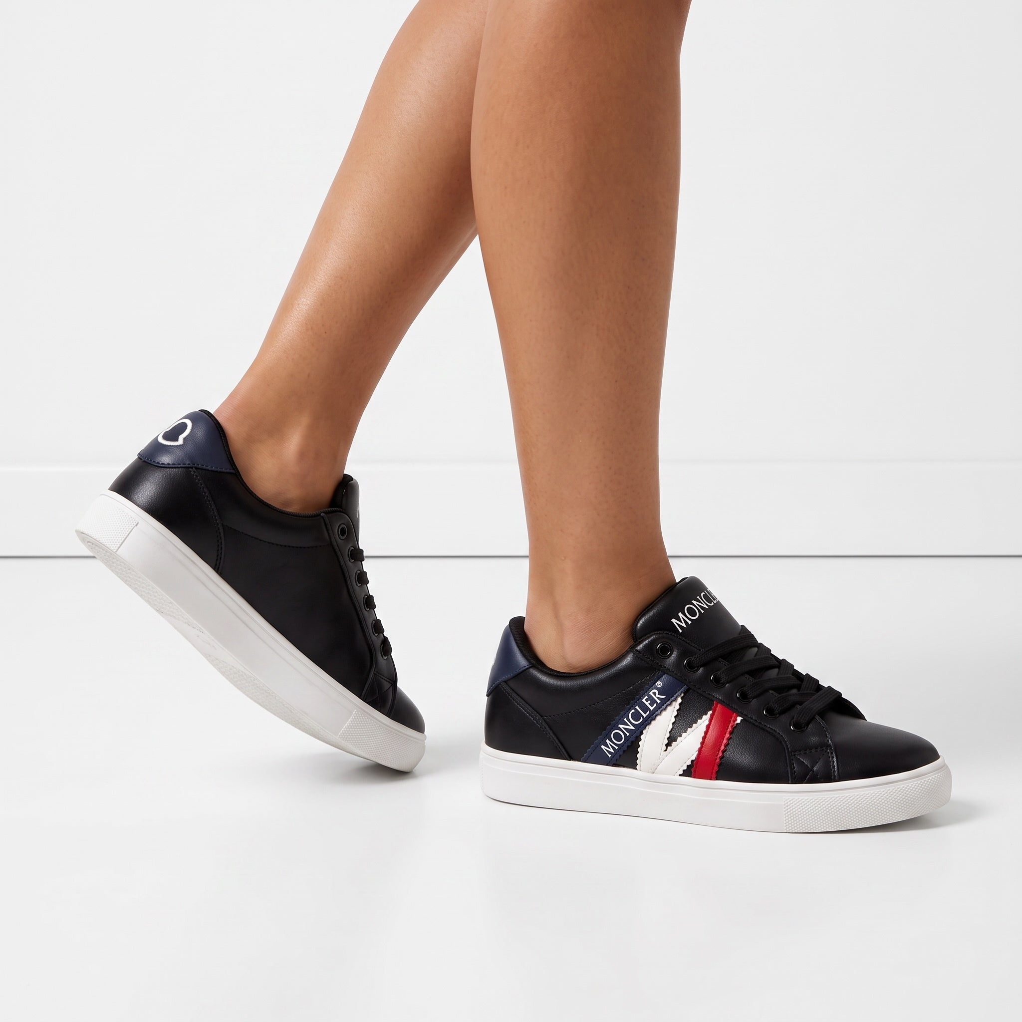 Moncler black low-top sneakers with blue white red stripes and white platform sole