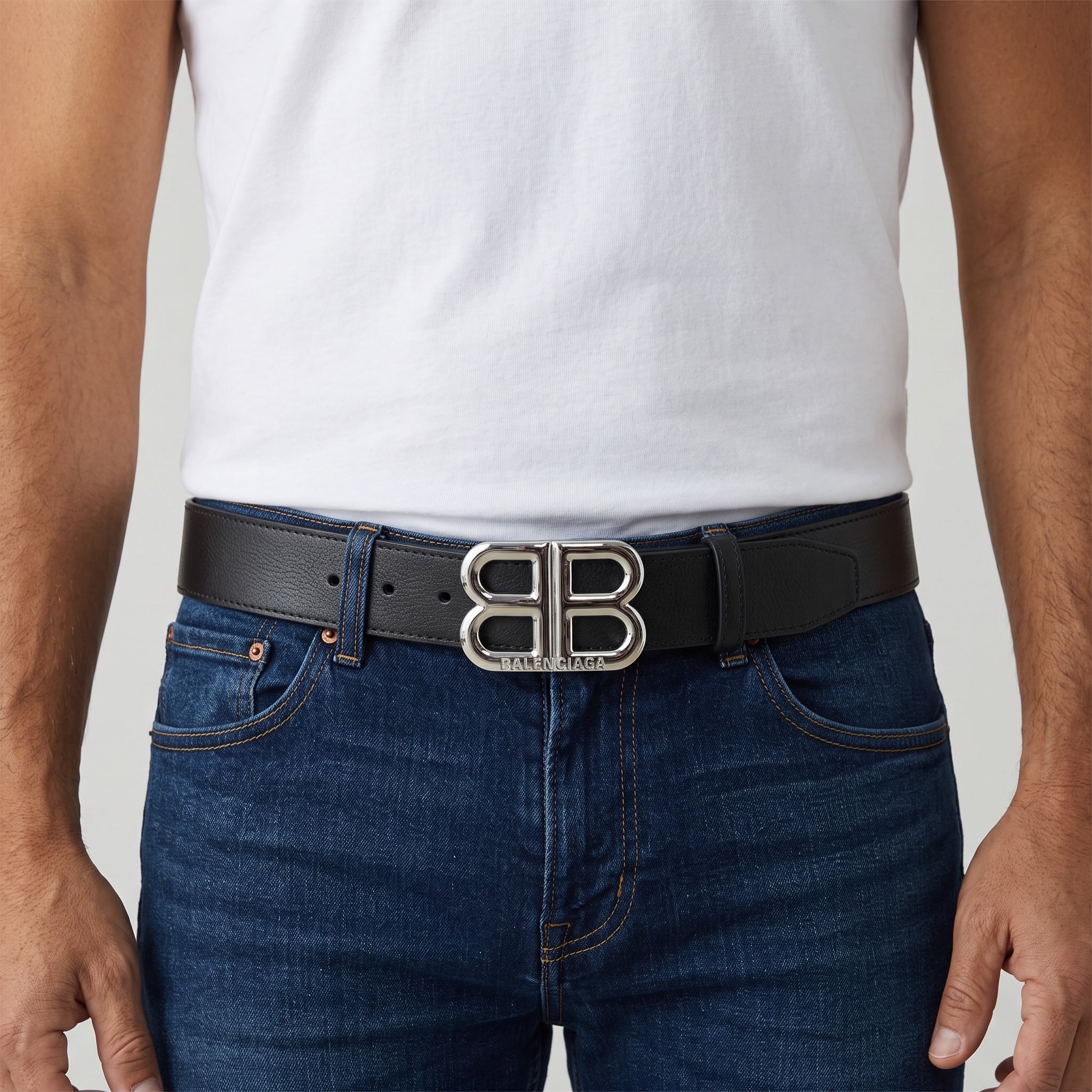 Black Balenciaga belt with silver Double B buckle worn at waist