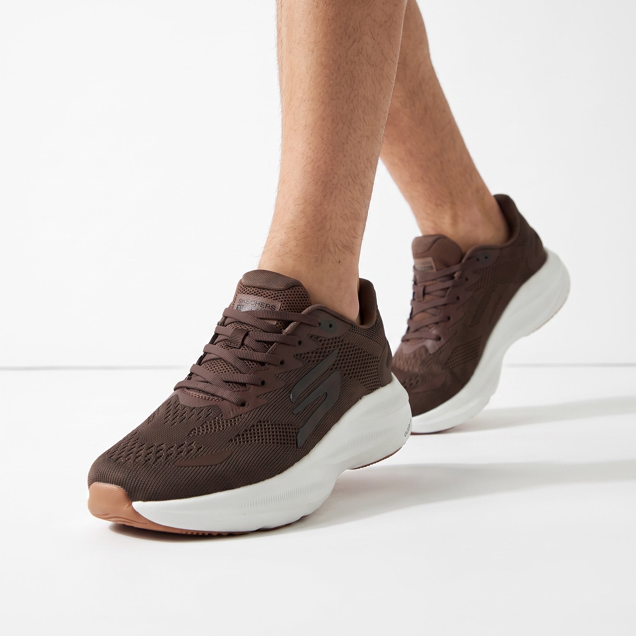 brown Skechers mesh sneakers with white sole