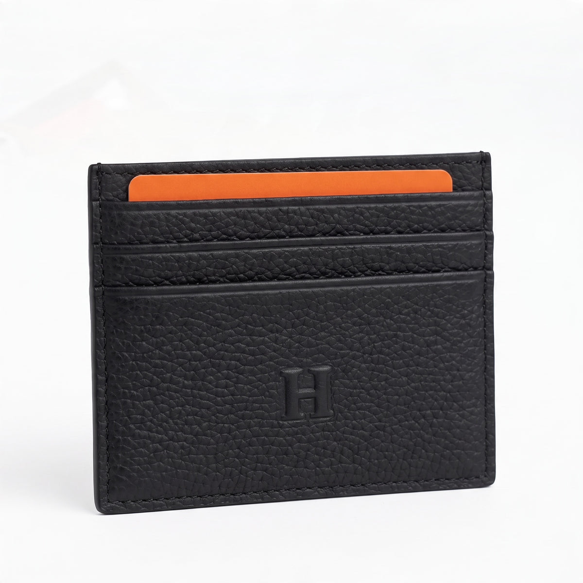 black pebbled Hermès card holder with embossed H and multiple card slots