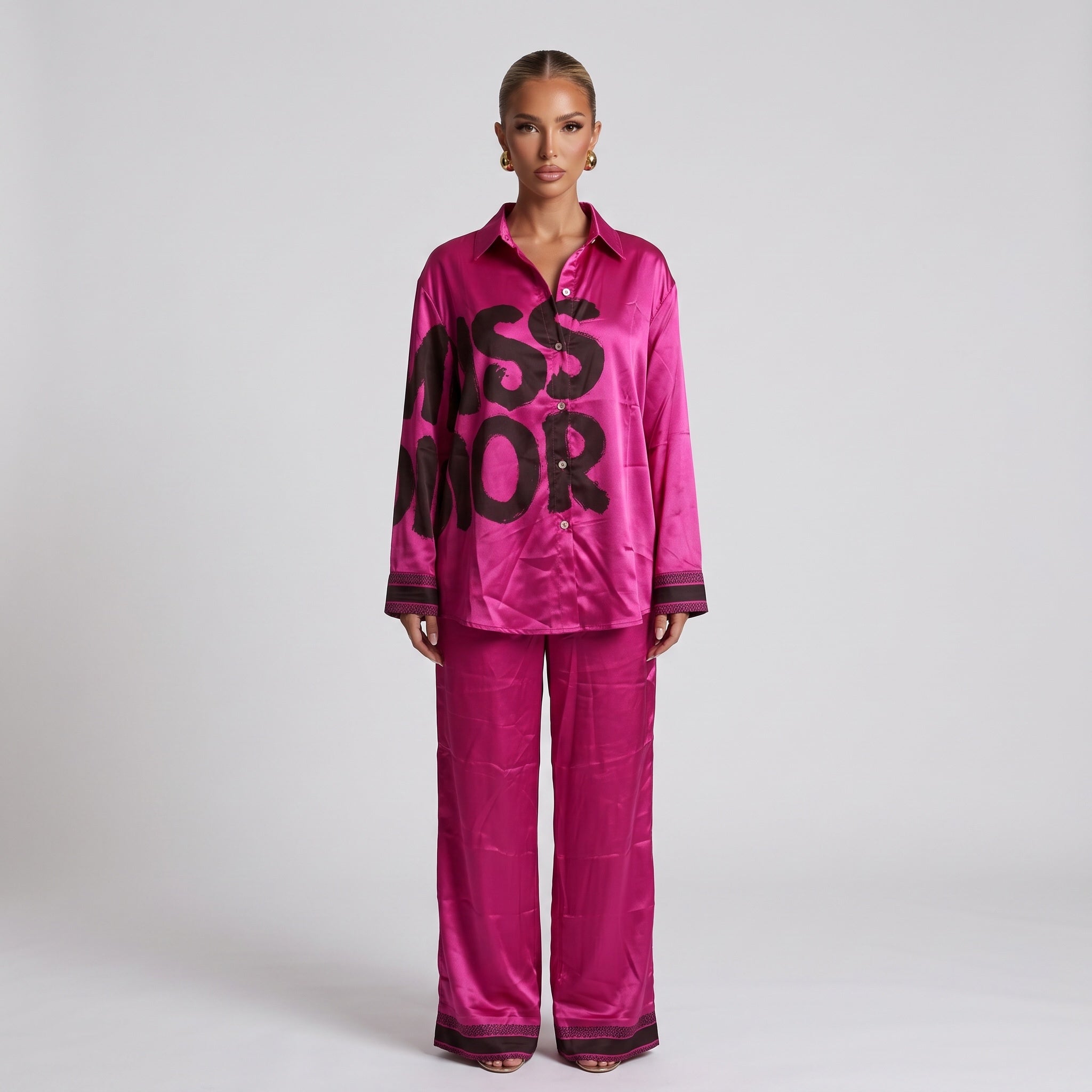 Fuchsia longline button-down shirt with black graphic lettering