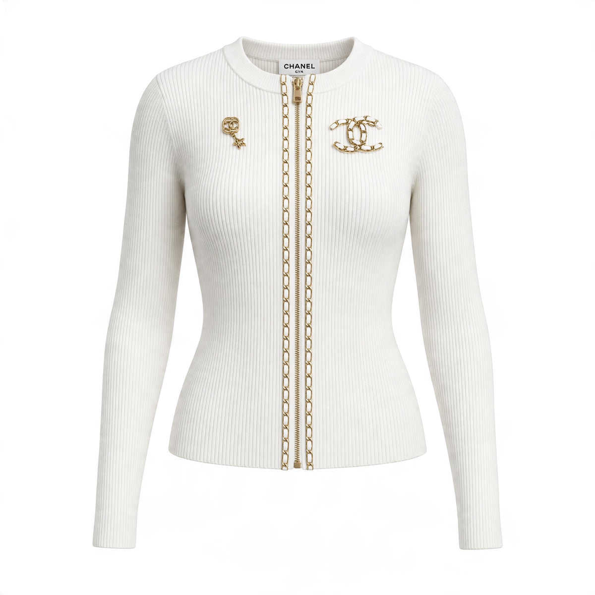 Cream ribbed Chanel zip cardigan with gold chain trim and CC brooch