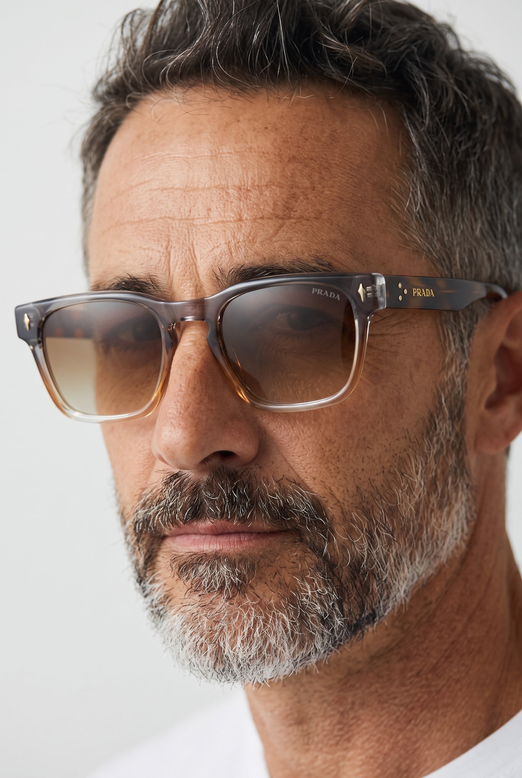 Prada square sunglasses with gradient grey to tortoise frame and gold logo on temple