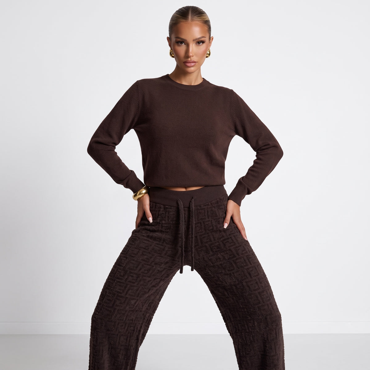 Brown Fendi track pants with all-over FF embossed texture and drawstring waist