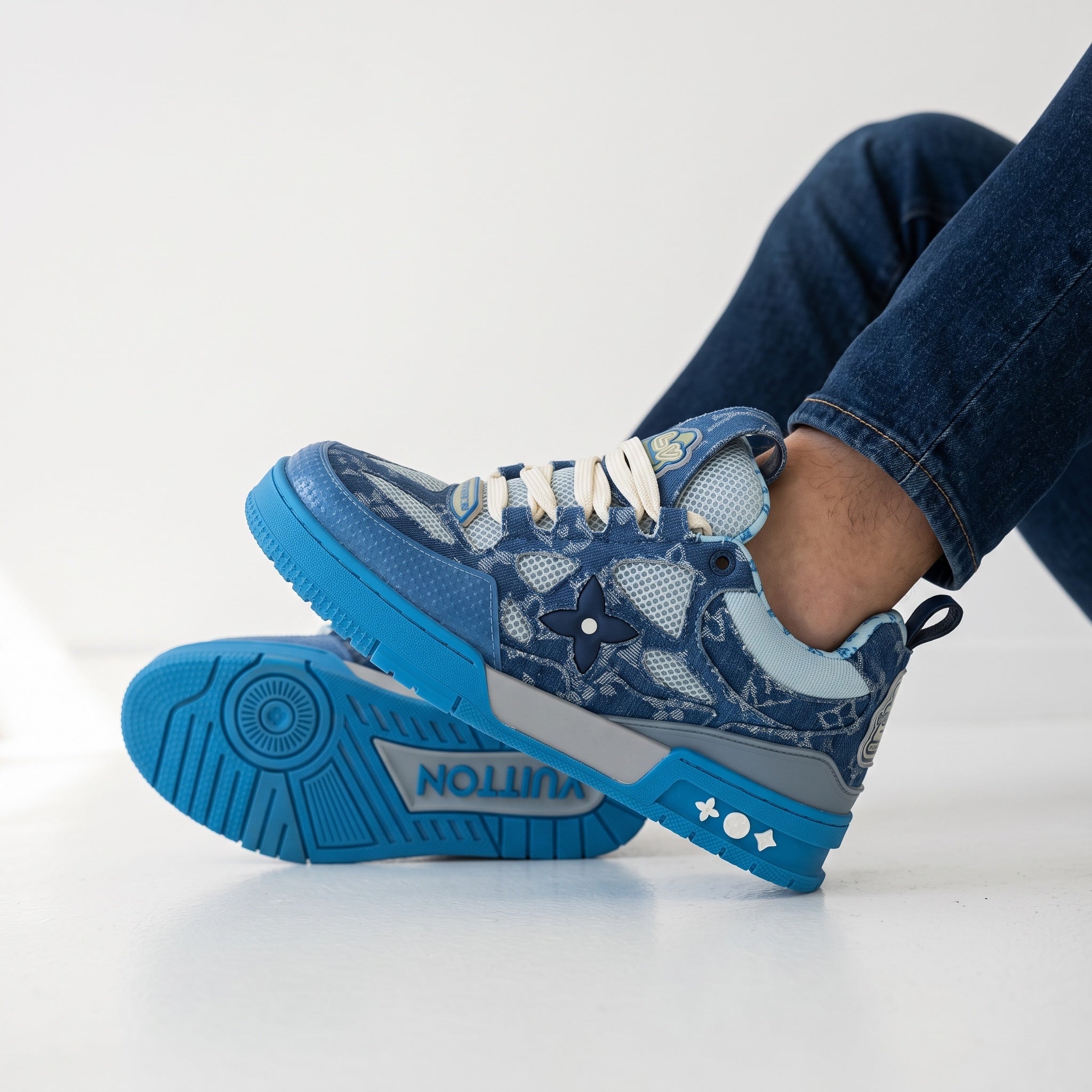 blue Louis Vuitton monogram low-top sneaker with bright blue sole