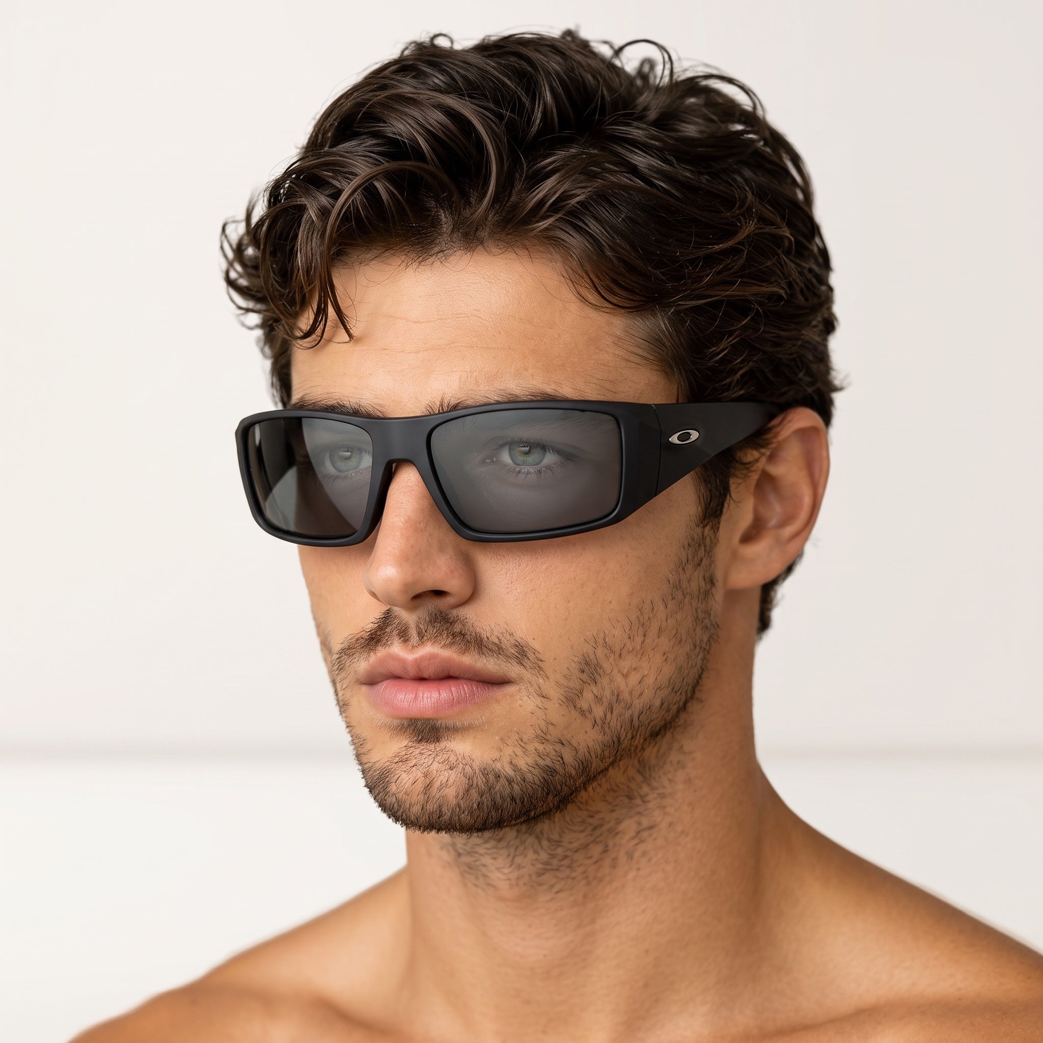 Man wearing Oakley matte black oversized wrap sunglasses