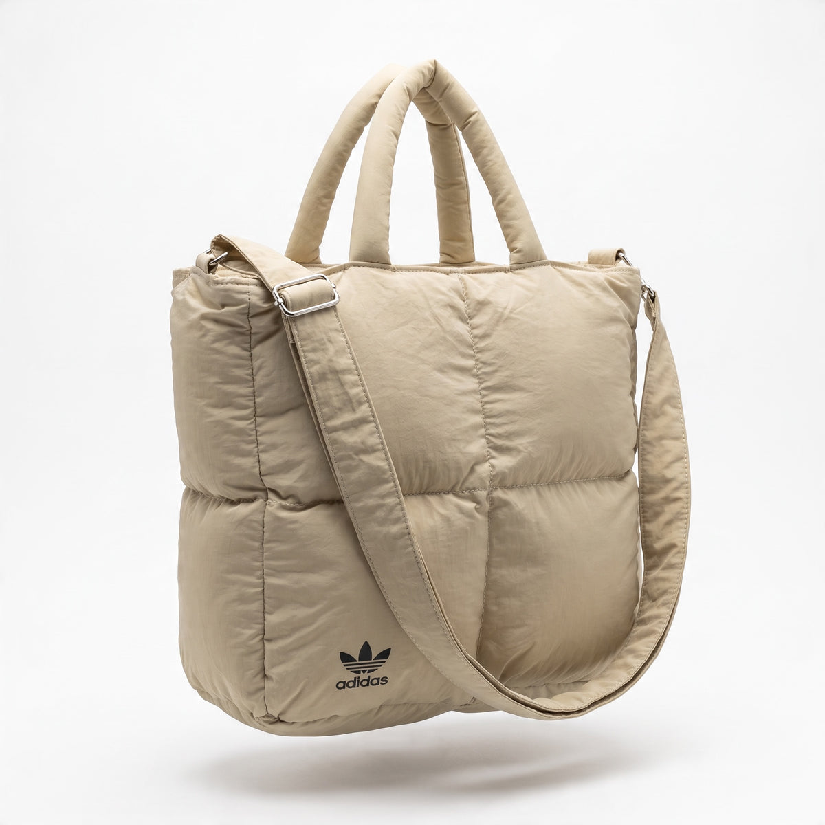 beige quilted adidas puffer tote with padded handles and adjustable strap