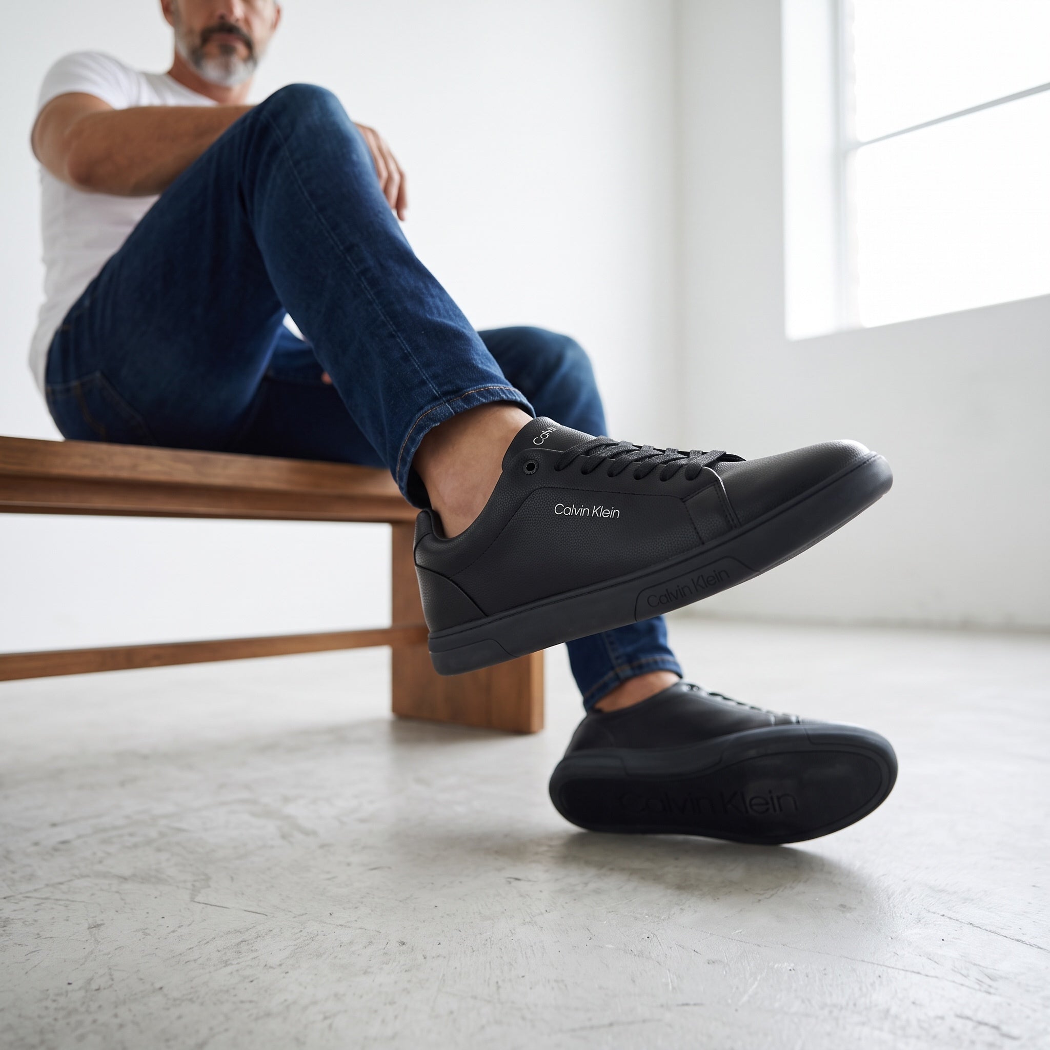 Calvin Klein black low-top sneakers with textured pebbled upper