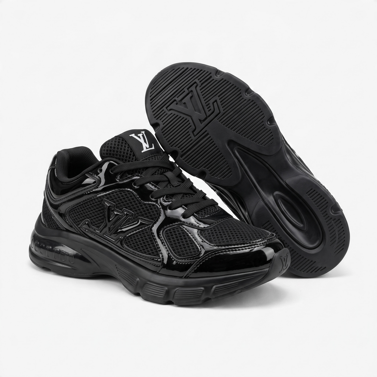 pair of all-black Louis Vuitton chunky sneakers with LV logo on tongue and sole