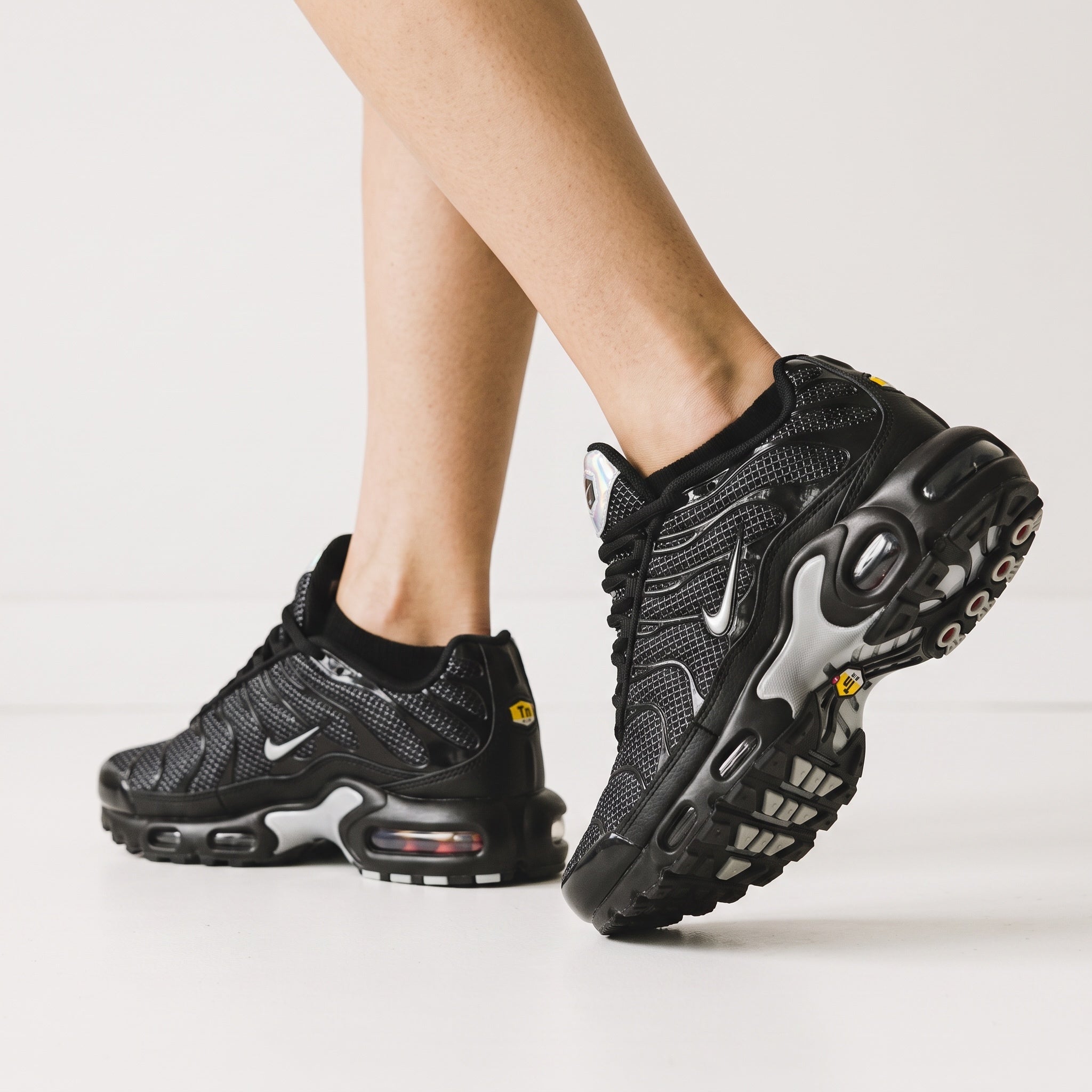 black Nike Tuned Air Max sneakers with visible air units