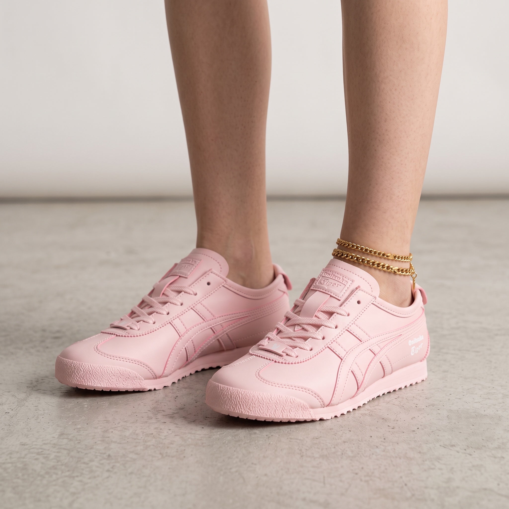 Onitsuka Tiger pastel pink low-top sneakers with tonal finish and textured sole