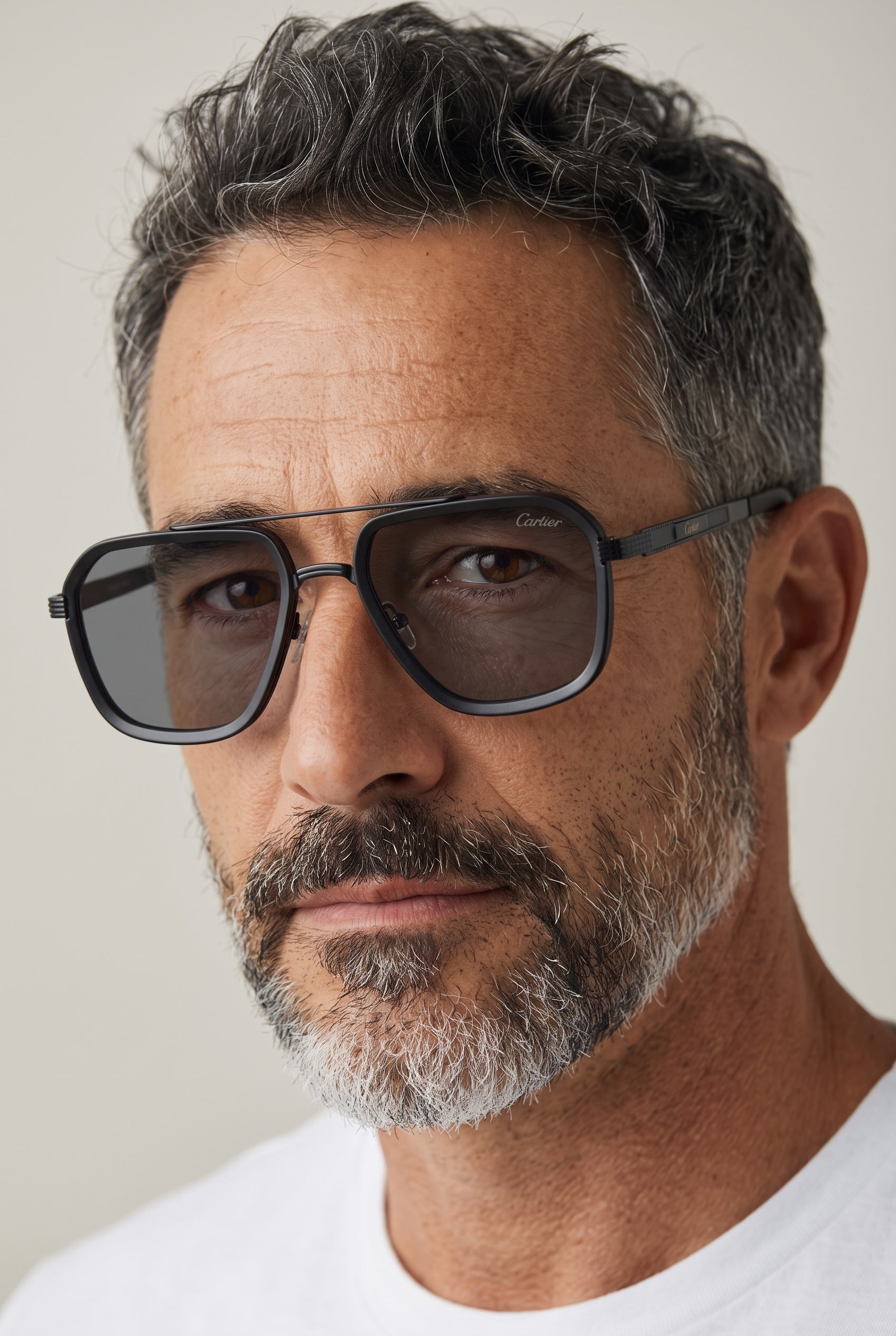 Cartier matte black aviator sunglasses with grey lenses on male model