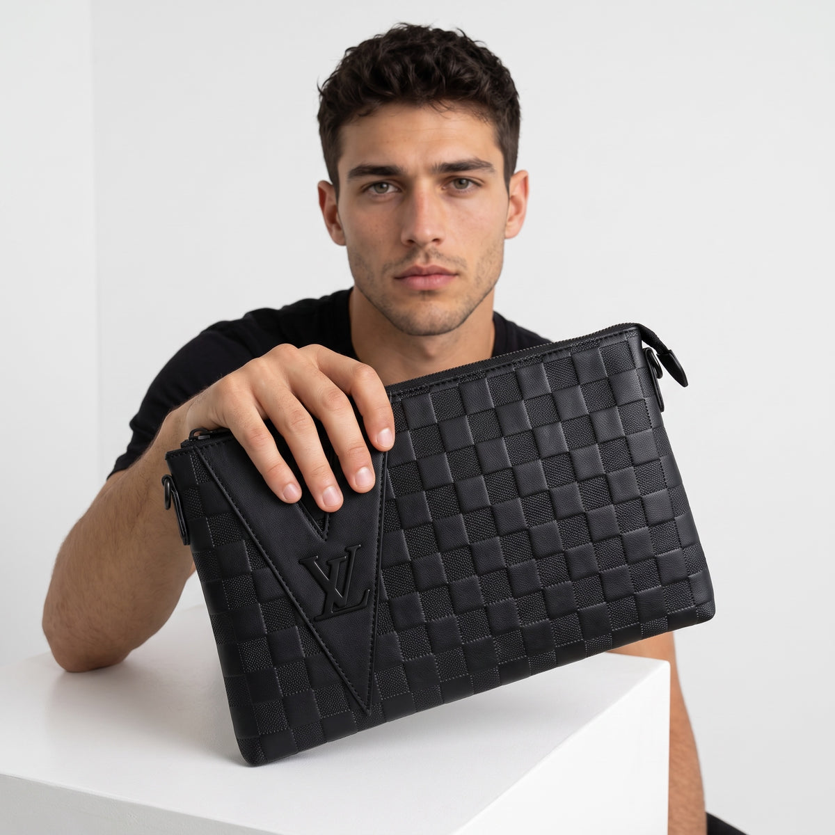 black Louis Vuitton checkered pouch with embossed LV logo