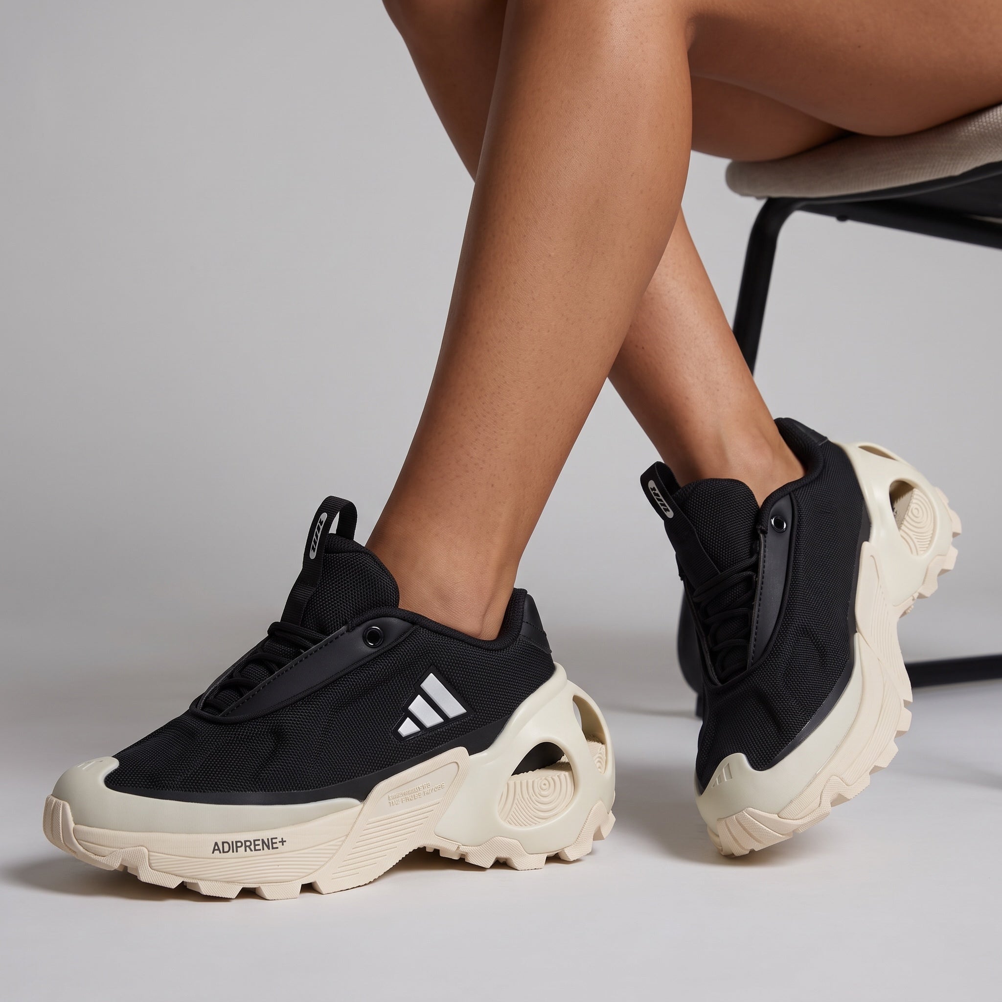 Black Adidas chunky sneakers with cream sculpted sole and ADIPRENE+ text