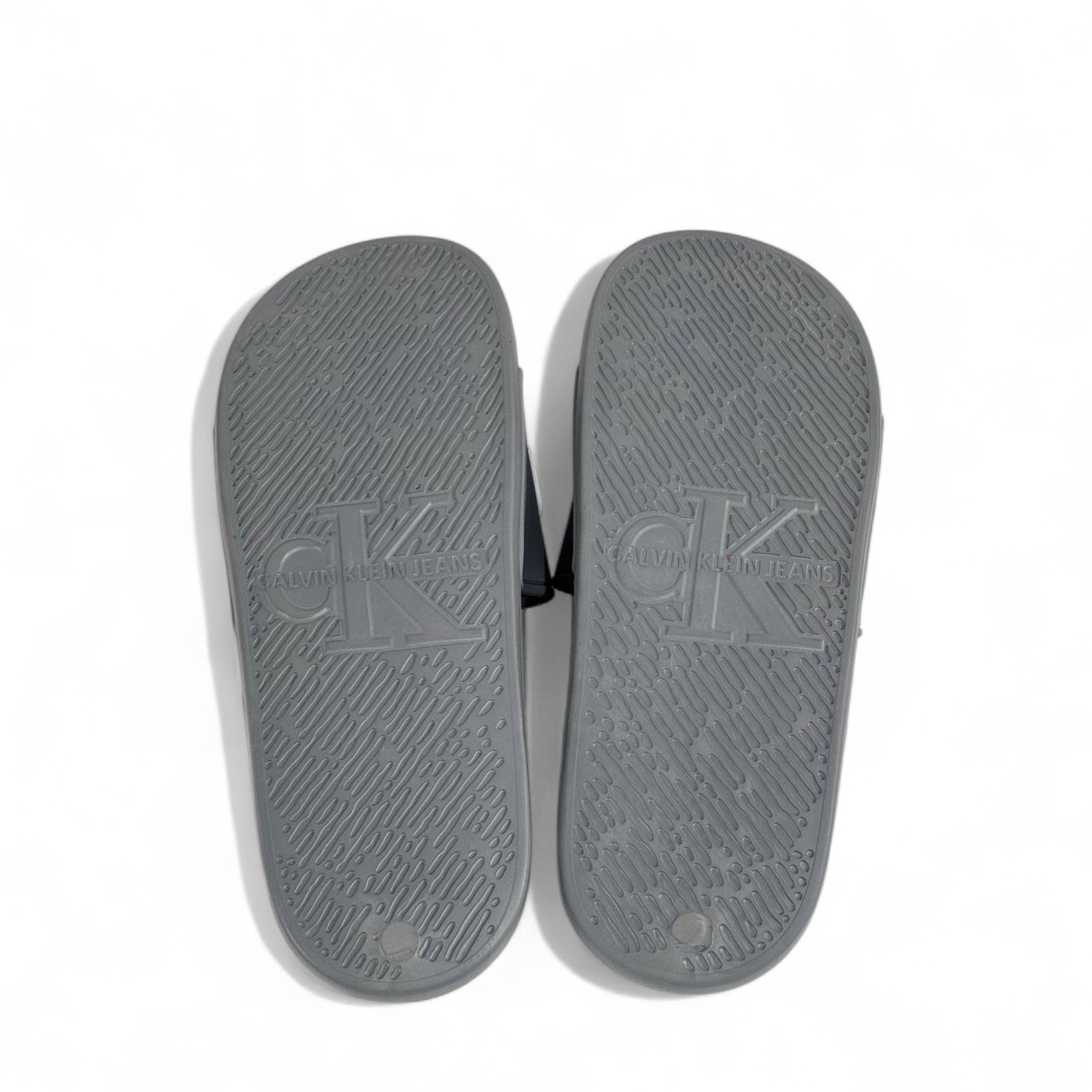 ⚪ Calvin Klein Grey Slides | Minimalist Comfort & Modern Style