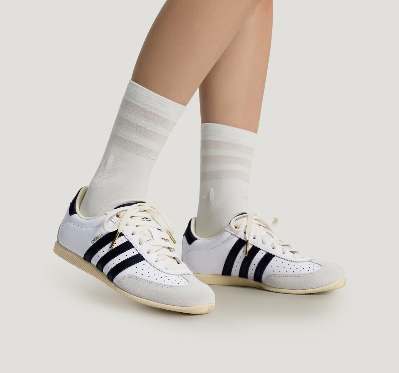 Adidas Chang Le white trainer with black stripes and pale grey suede toe