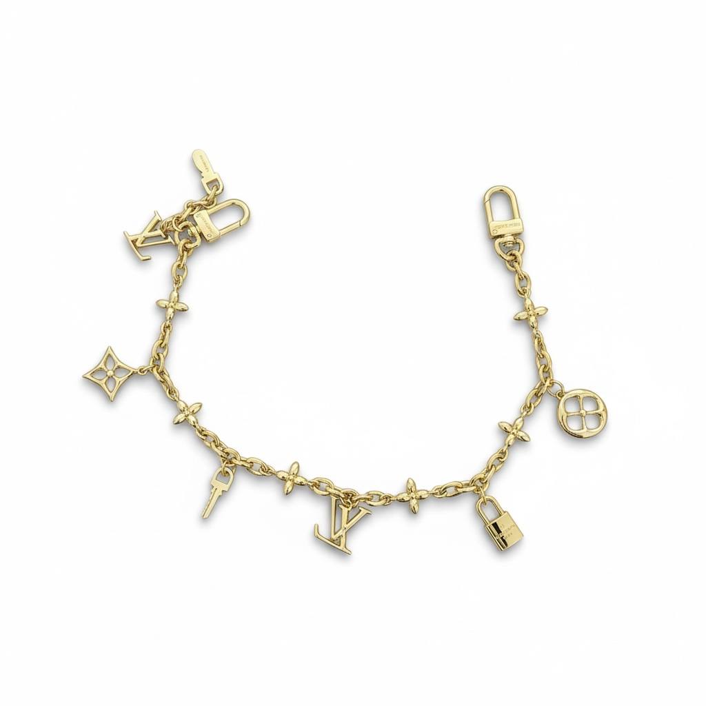 Louis Vuitton Gold Bag Charm – Iconic LV Monogram Accessory ✨💛