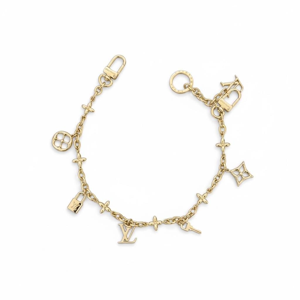 Louis Vuitton Gold Bag Charm – Iconic LV Monogram Accessory ✨💛