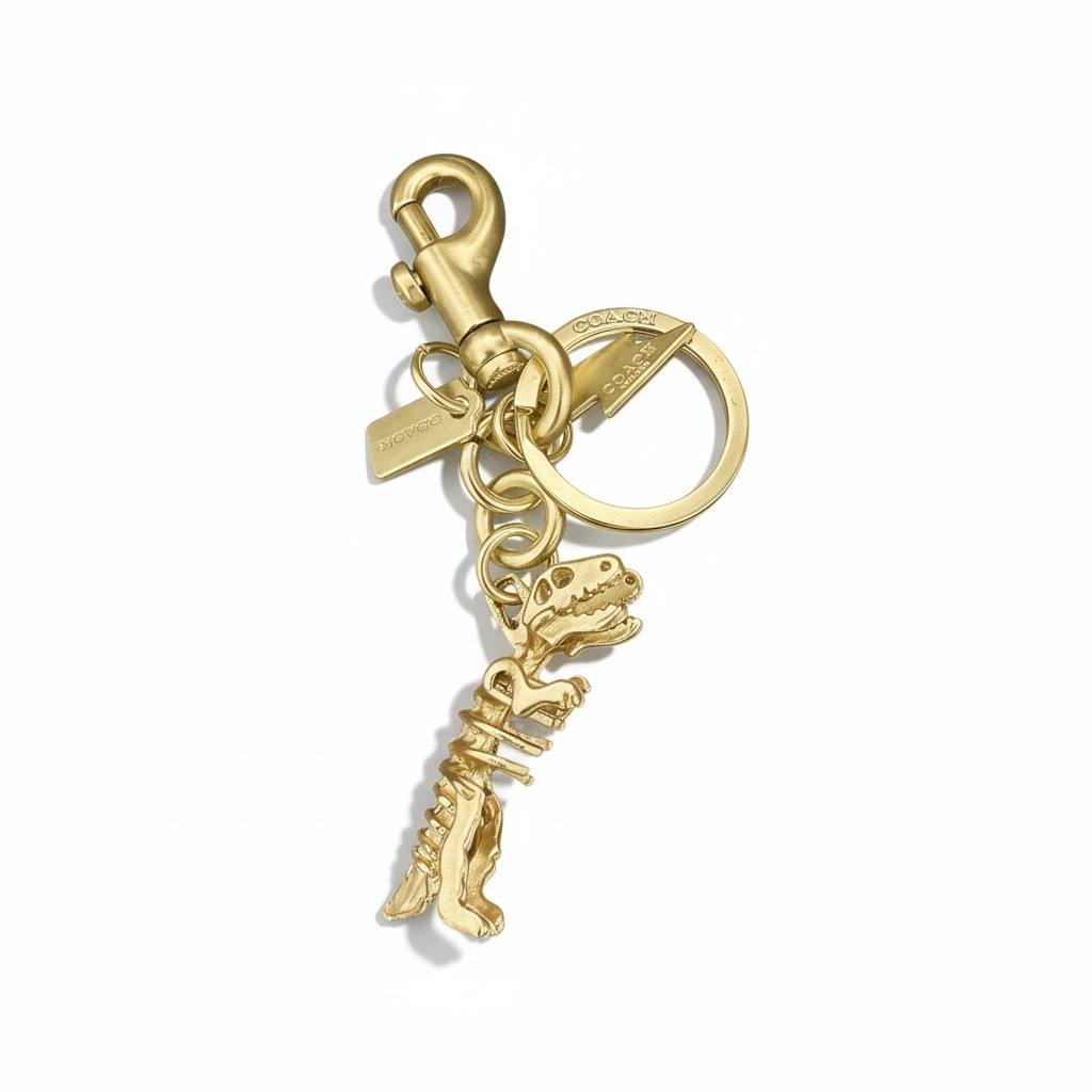 💛 Coach Rexy Gold Dinosaur Keychain – Iconic Designer Charm