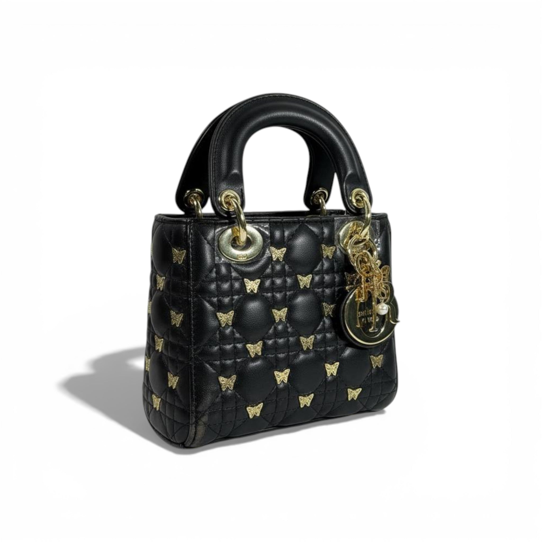 👜 Dior Black Quilted Mini Top-Handle Bag with Gold Butterfly Details 🖤✨