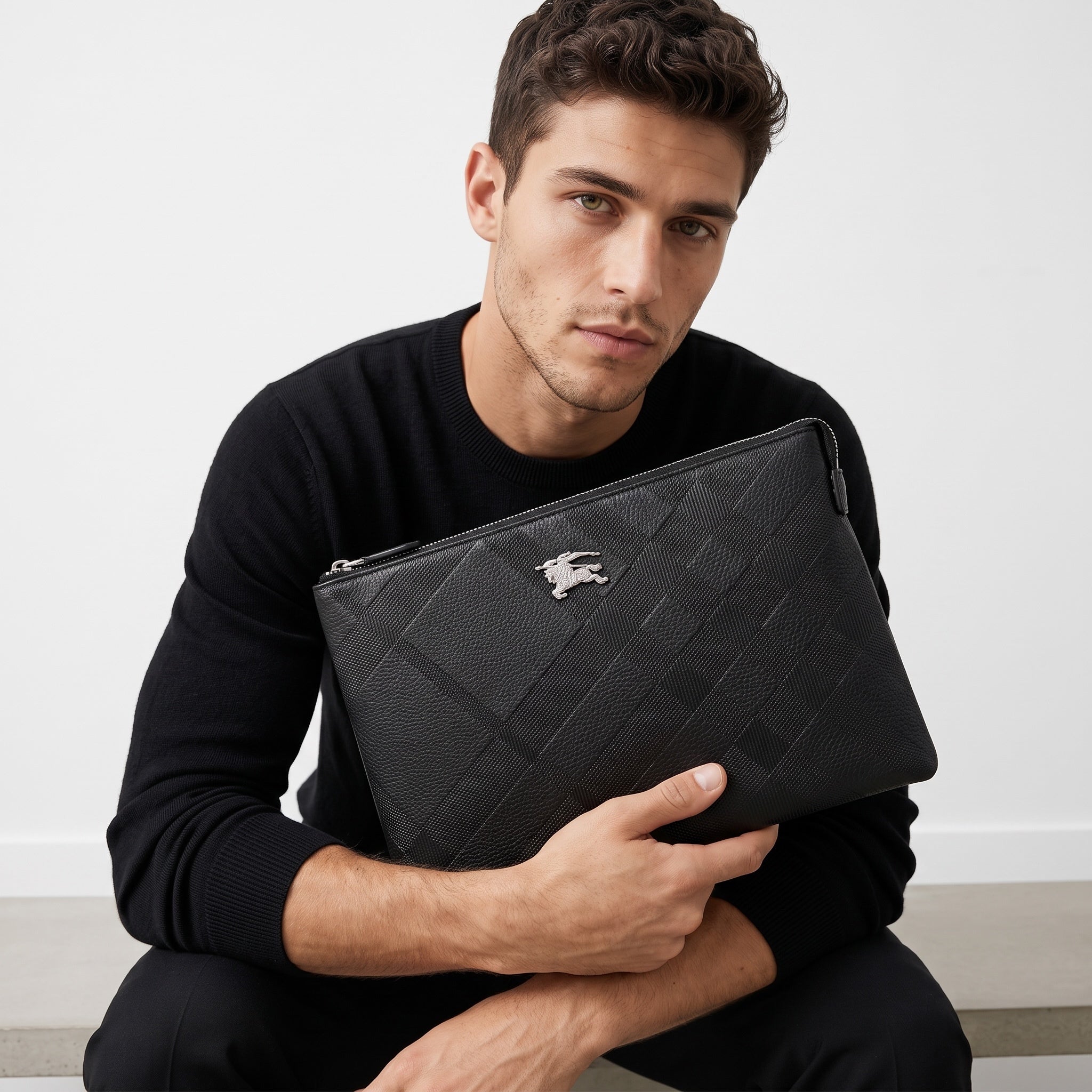 Black Burberry zip pouch with tonal check and metal equestrian logo