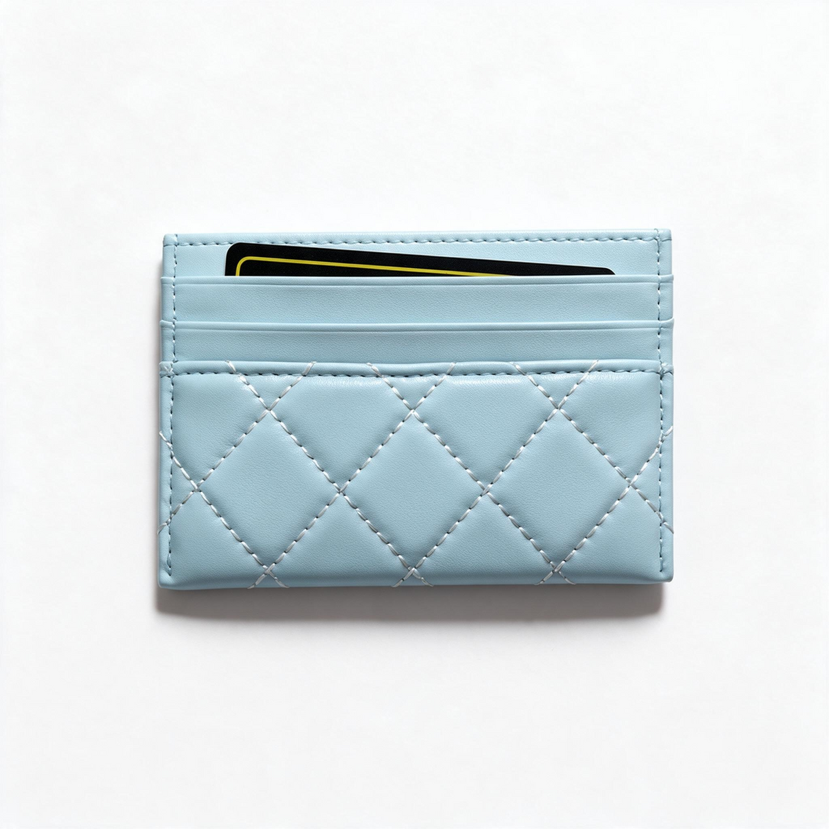 Light blue quilted Chanel card holder with gold CC logo