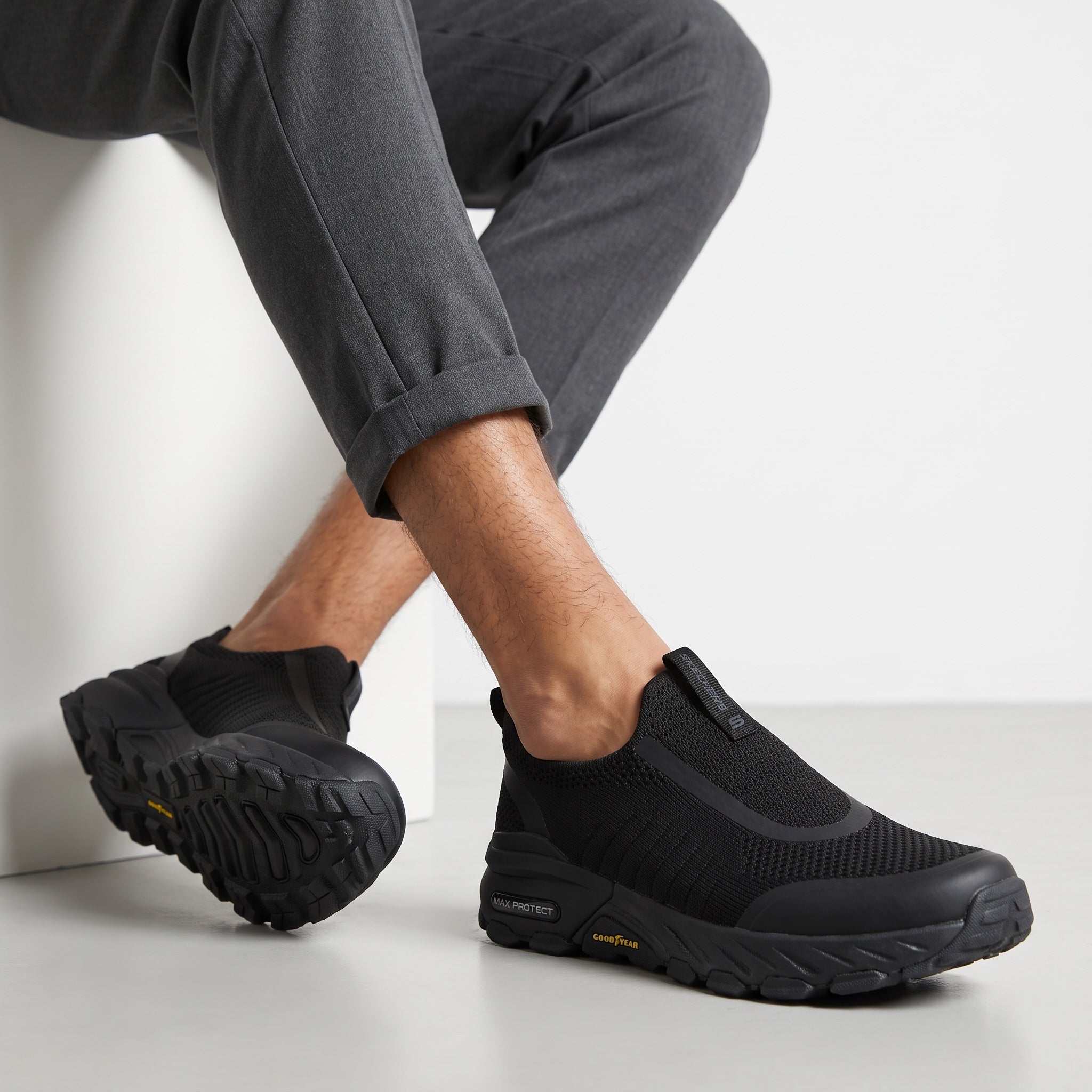 black Skechers slip-on knit sneakers with Goodyear sole