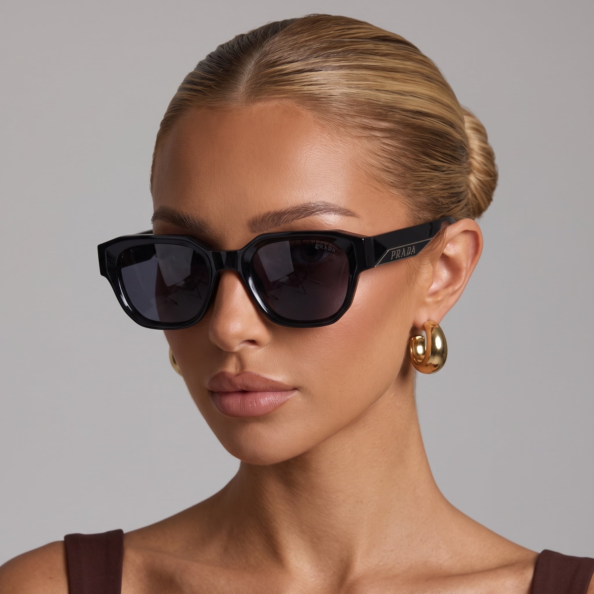 Black Prada chunky cat-eye sunglasses on model