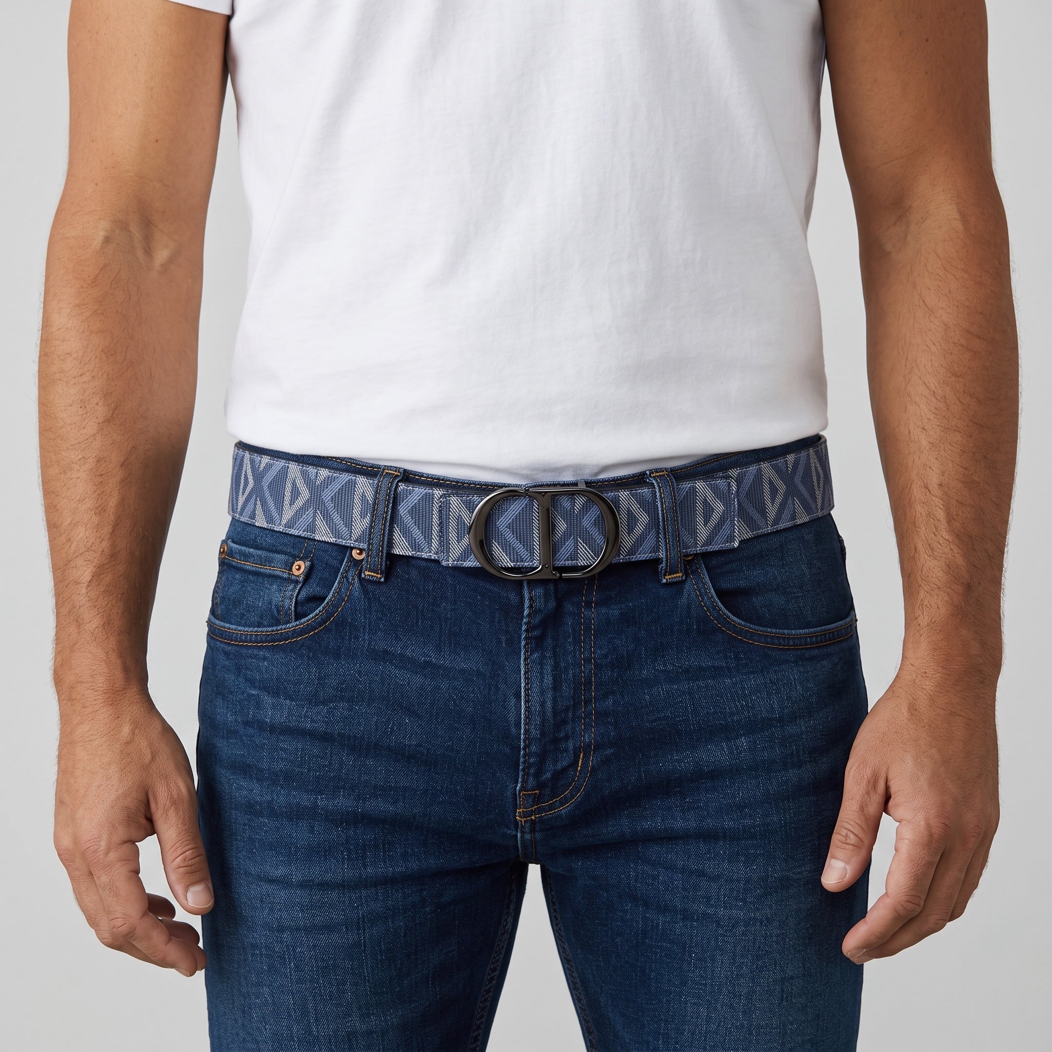 Blue Dior belt with dark CD buckle worn with jeans